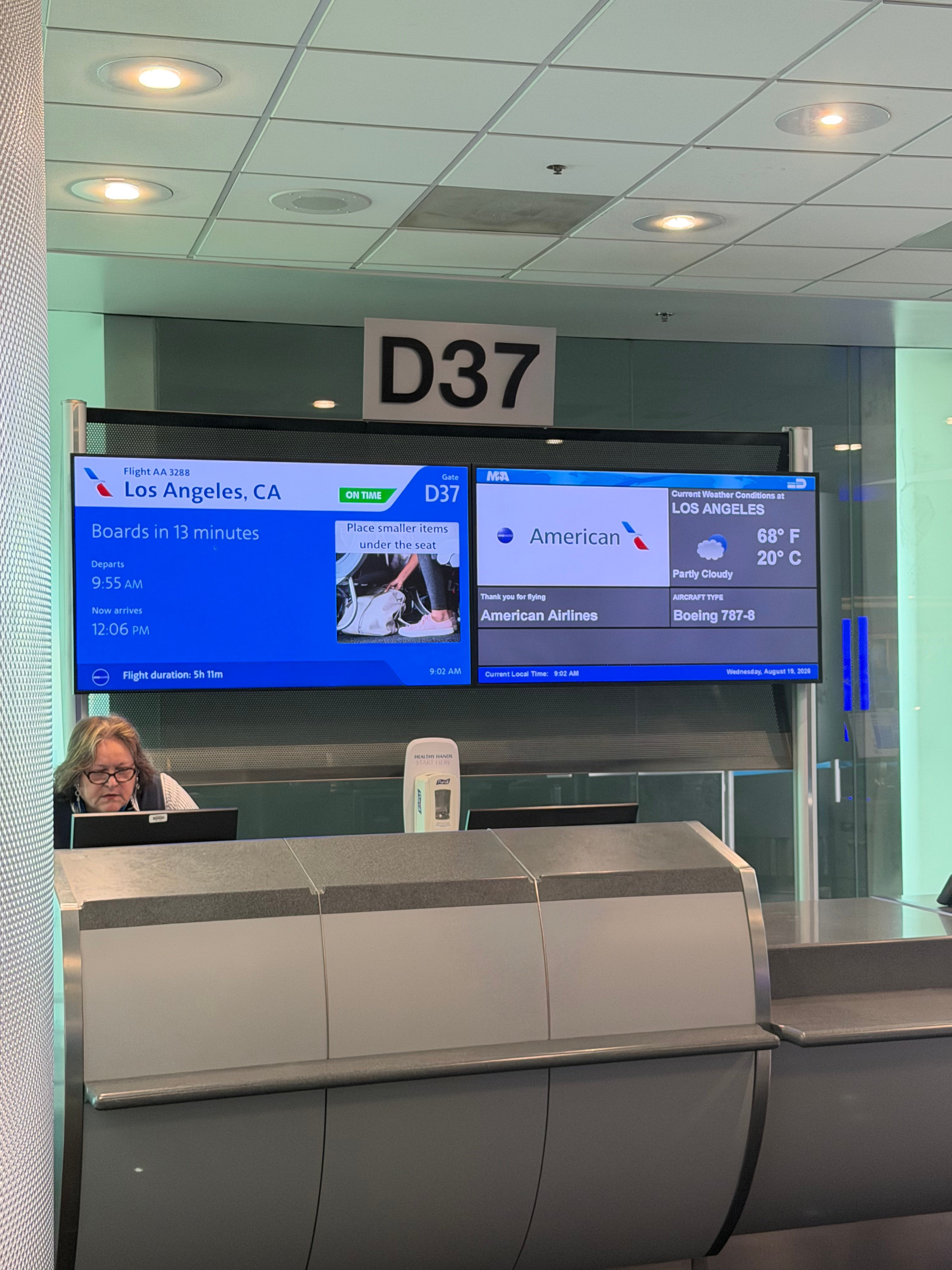 Gate D37 screen showing American Airlines flight AA3288 from Miami to Los Angeles on a Boeing 787-8.