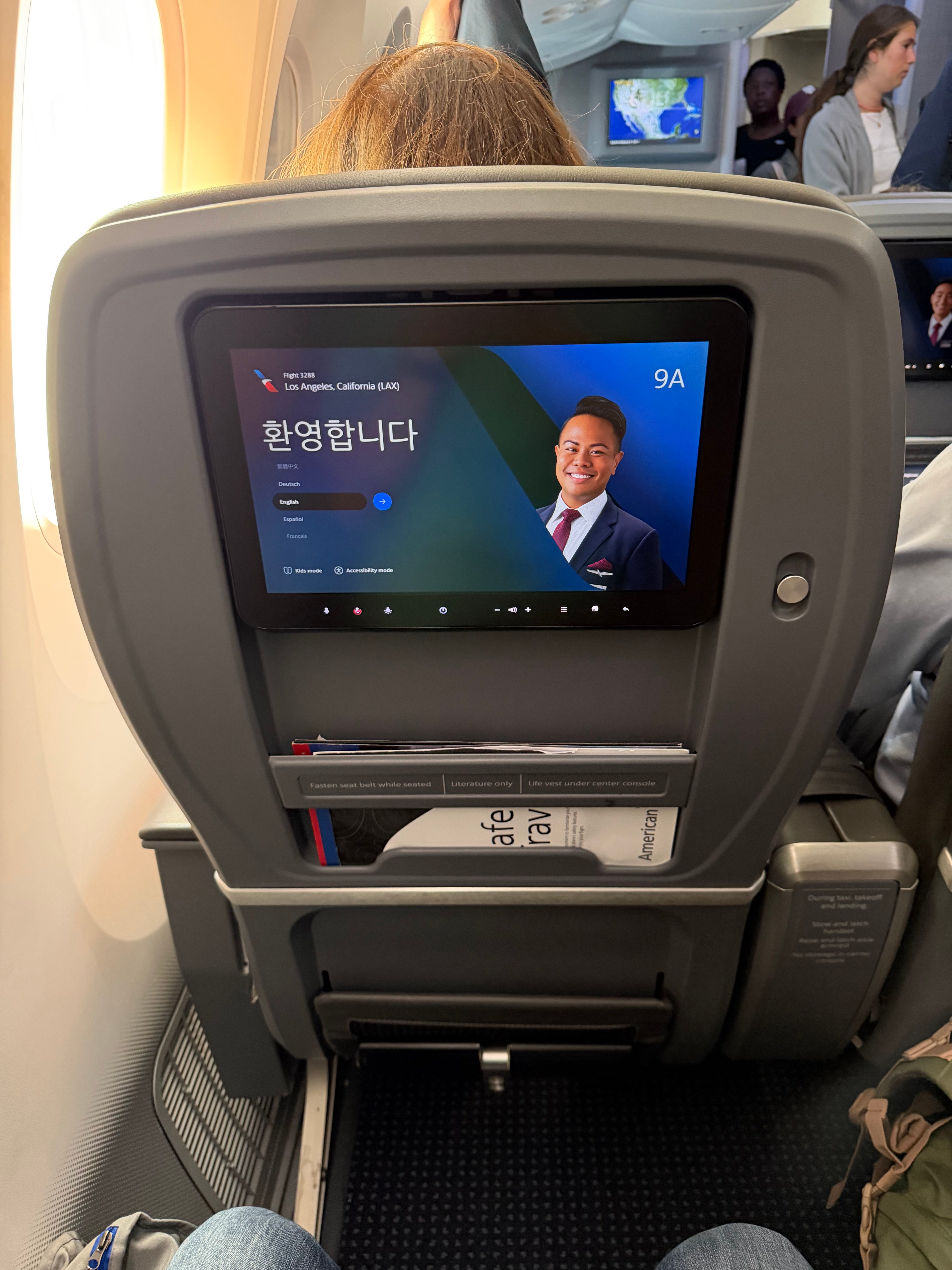 Entertainment screen at American Airlines seat 9A before departure.