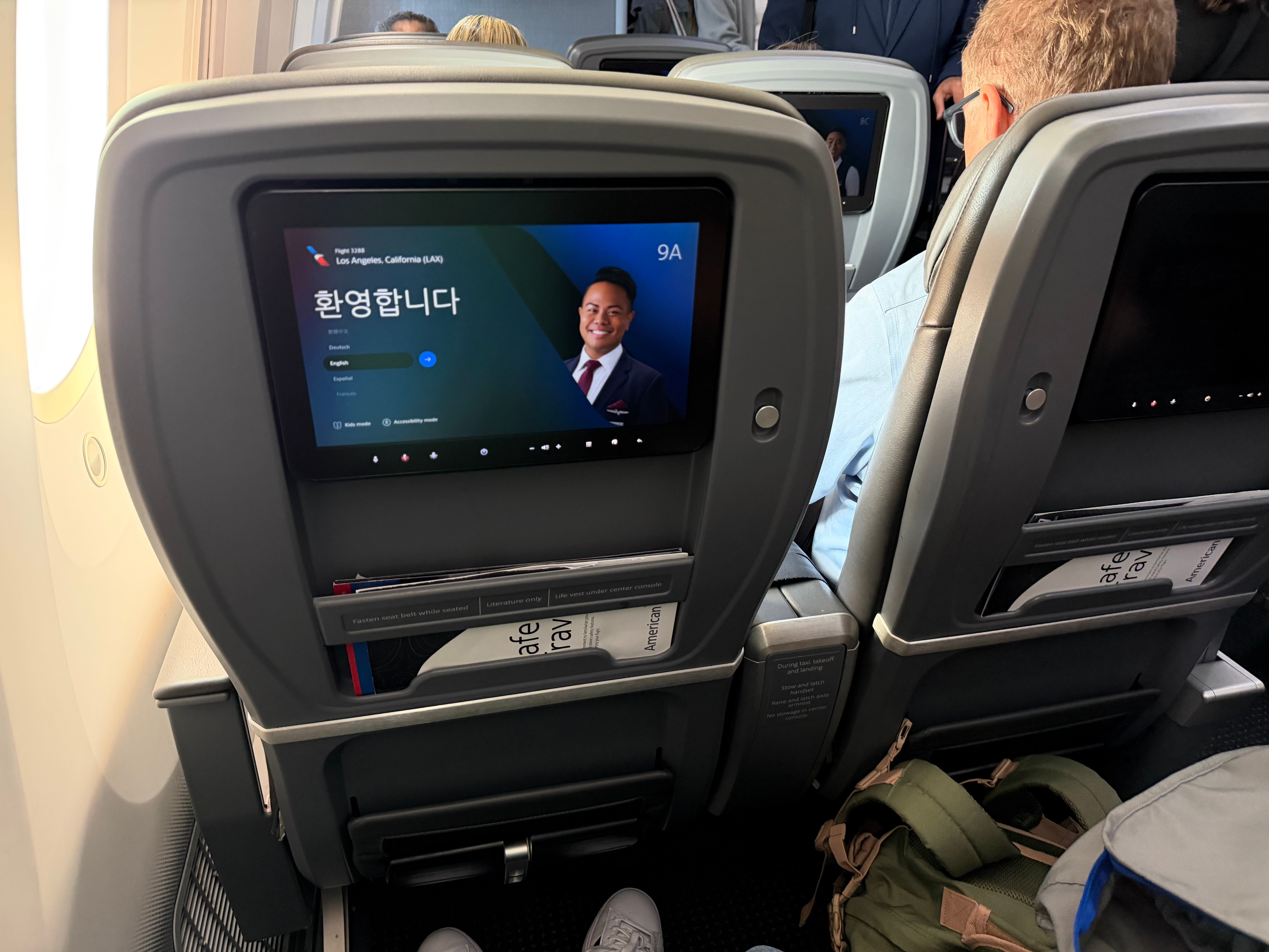 Two seatback entertainment screens in the American 787-8 Main Cabin Extra cabin.