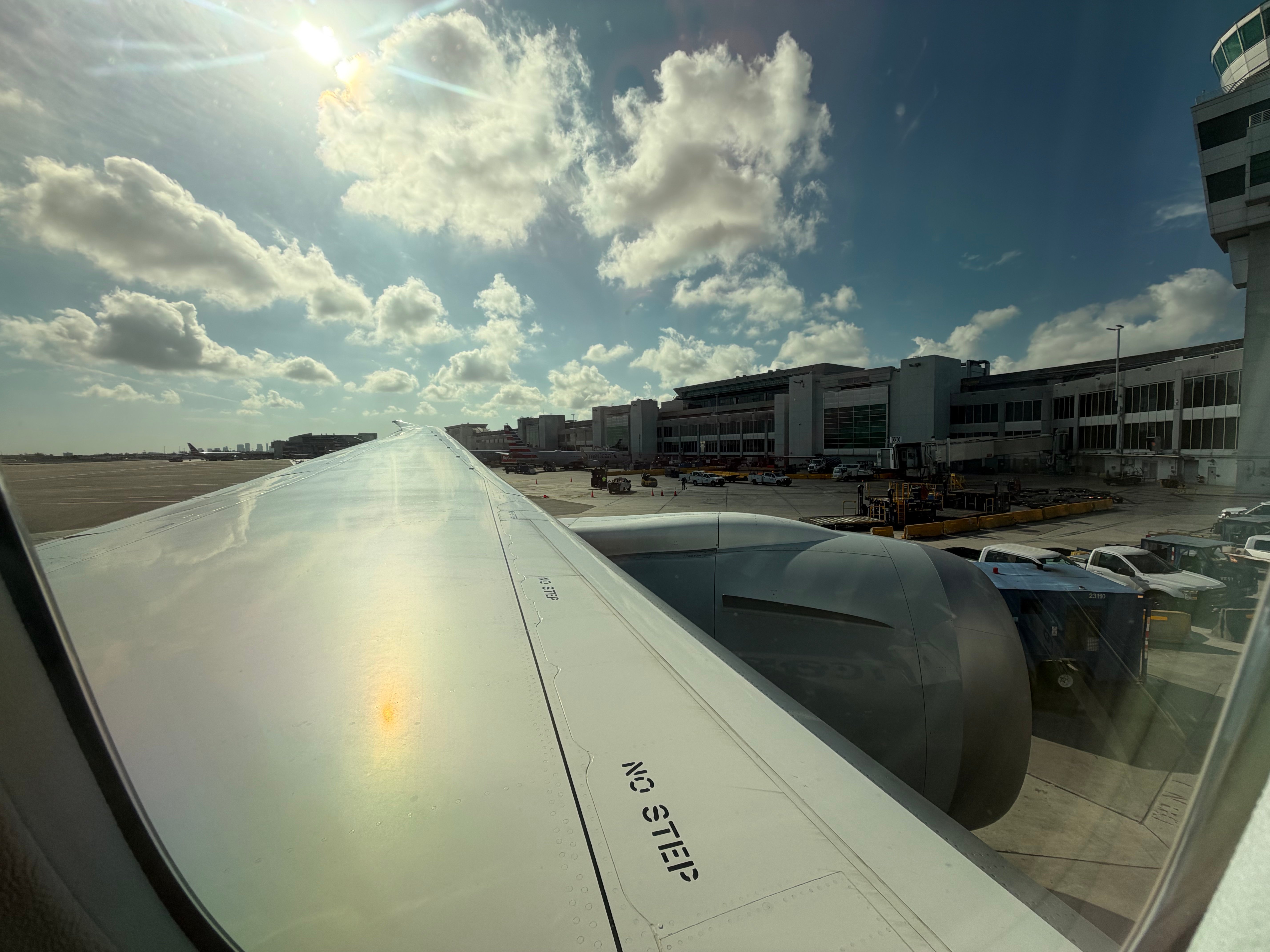 American Airlines Boeing 787-8 wing seen from seat 9A at the gate in Miami.