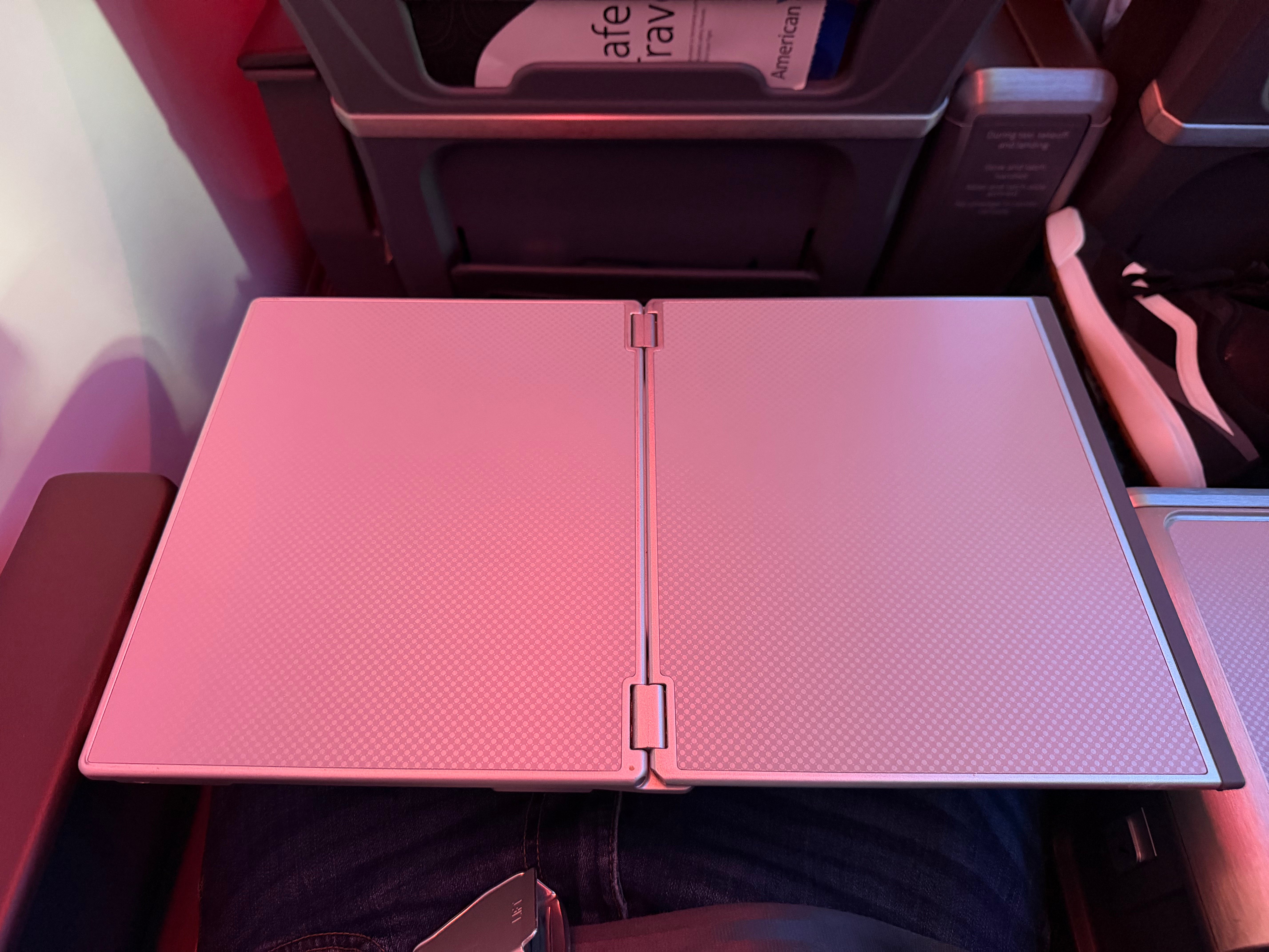 Tray table fully open at an American 787-8 Main Cabin Extra seat.