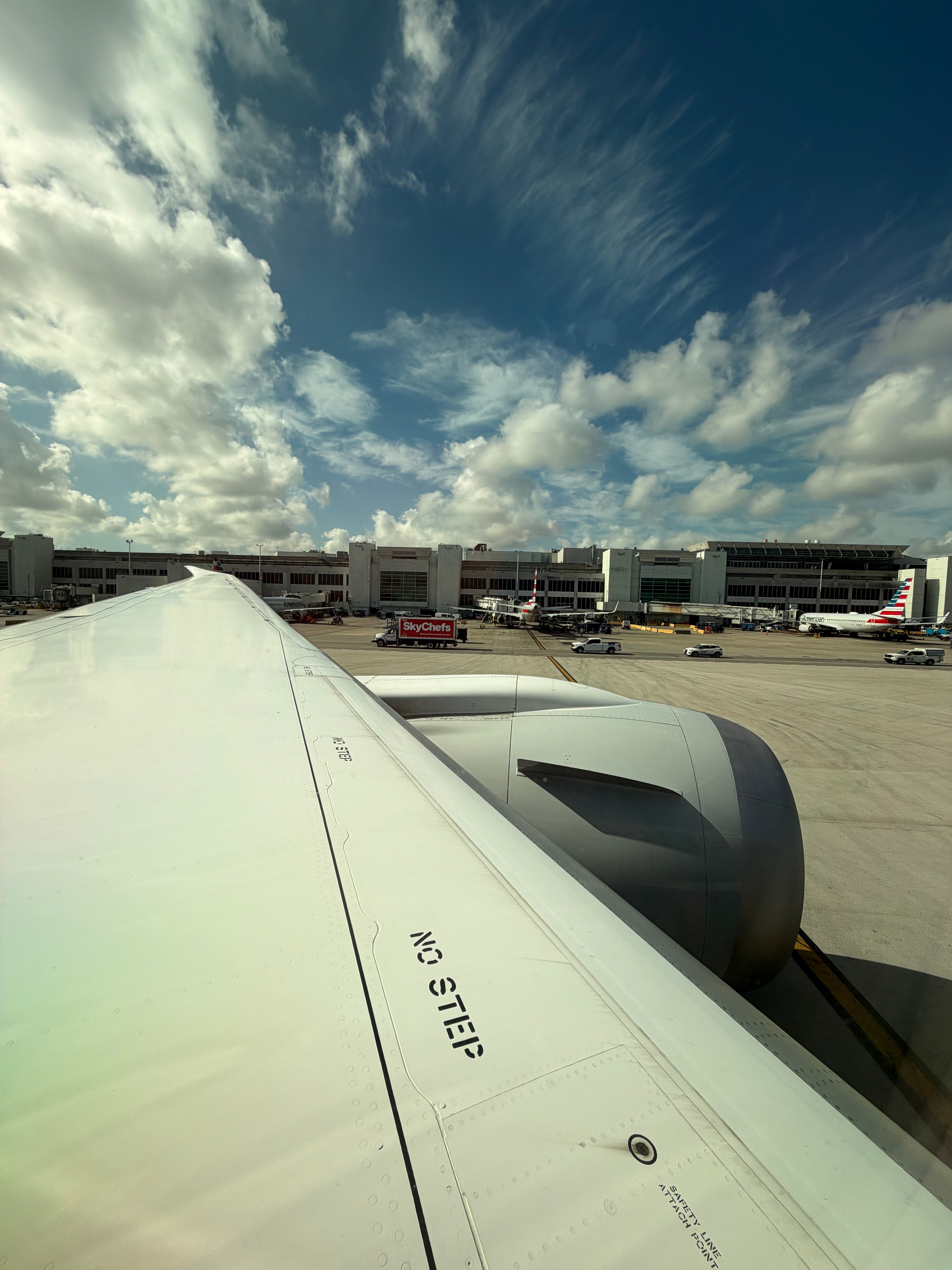 Boeing 787-8 wing before departure from Miami International Airport.