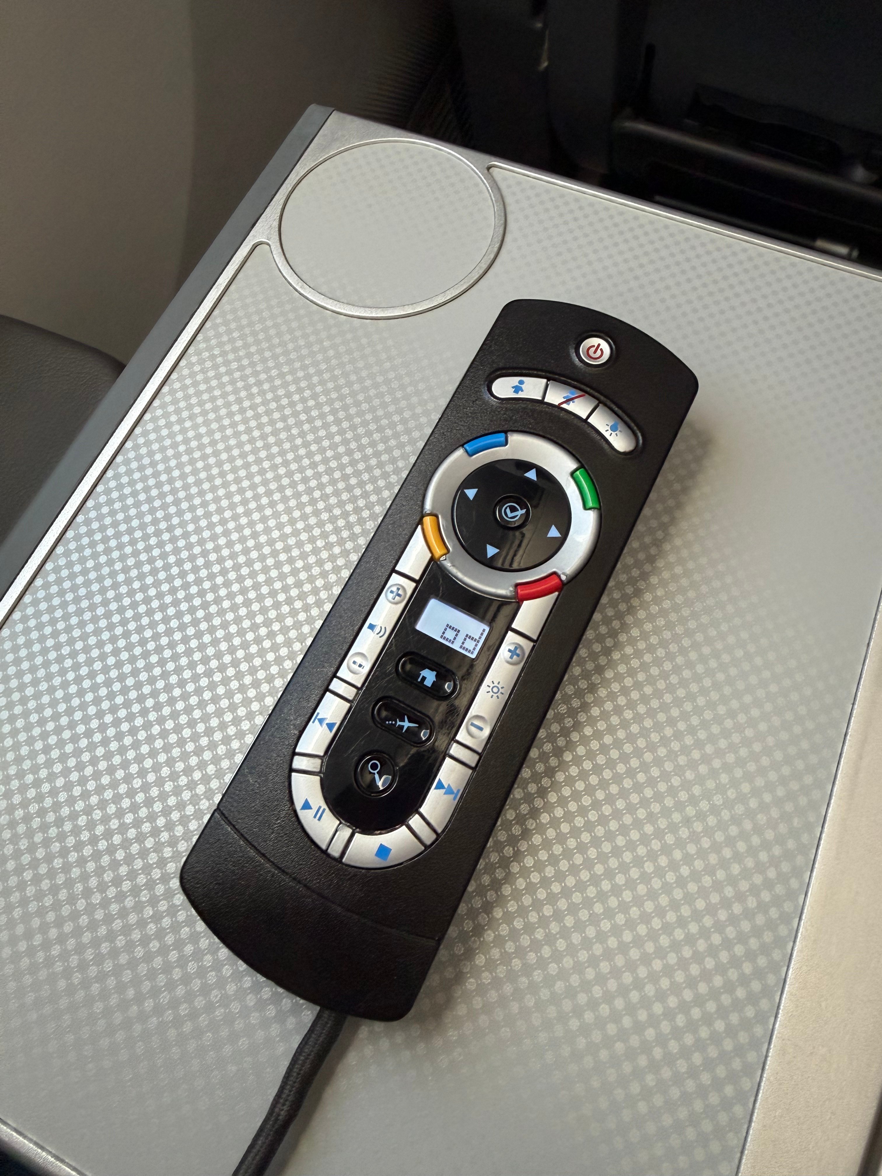 Front of the entertainment remote in American Airlines Main Cabin Extra.