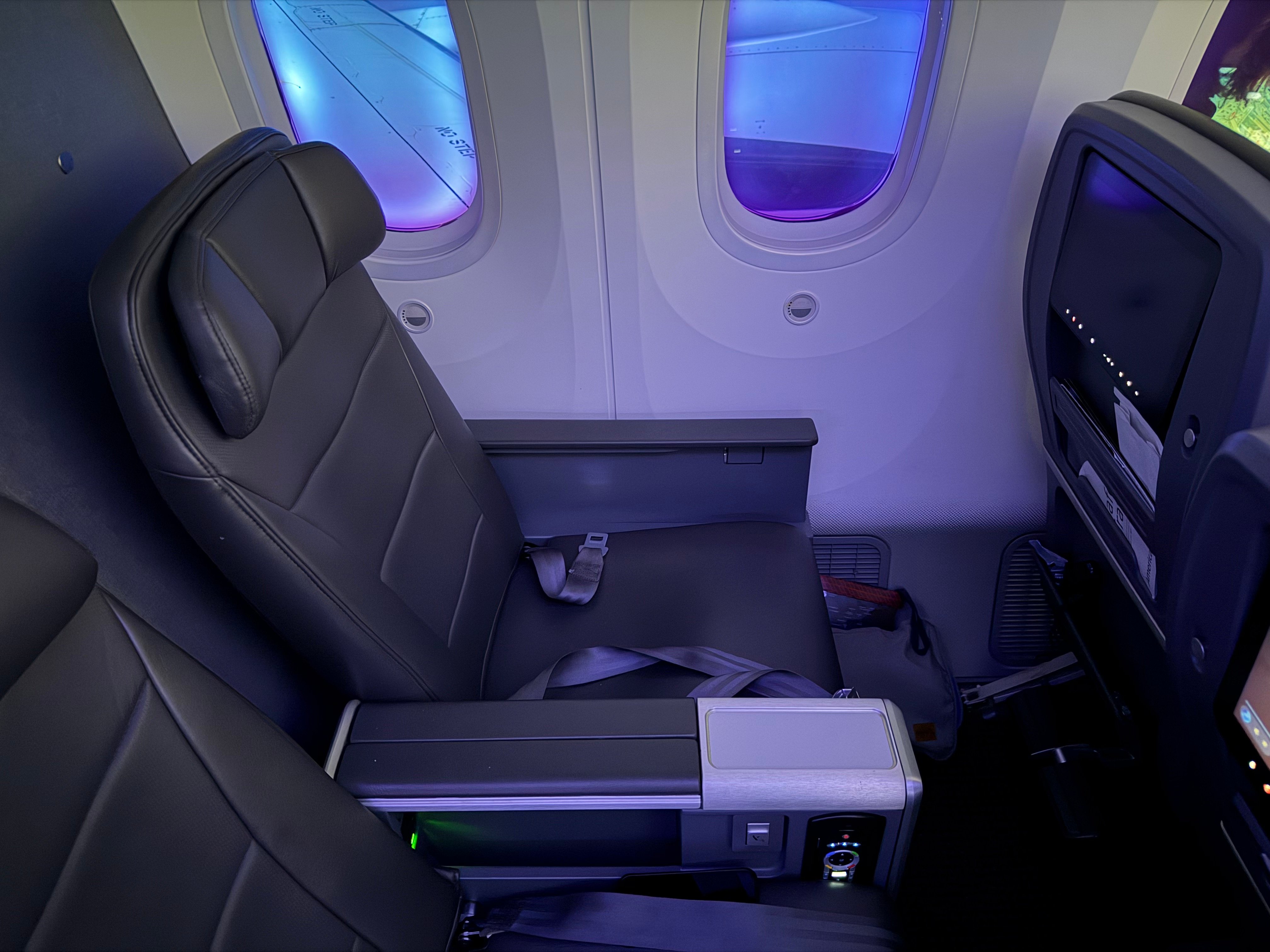 Pair of lightly occupied Main Cabin Extra seats during the flight.