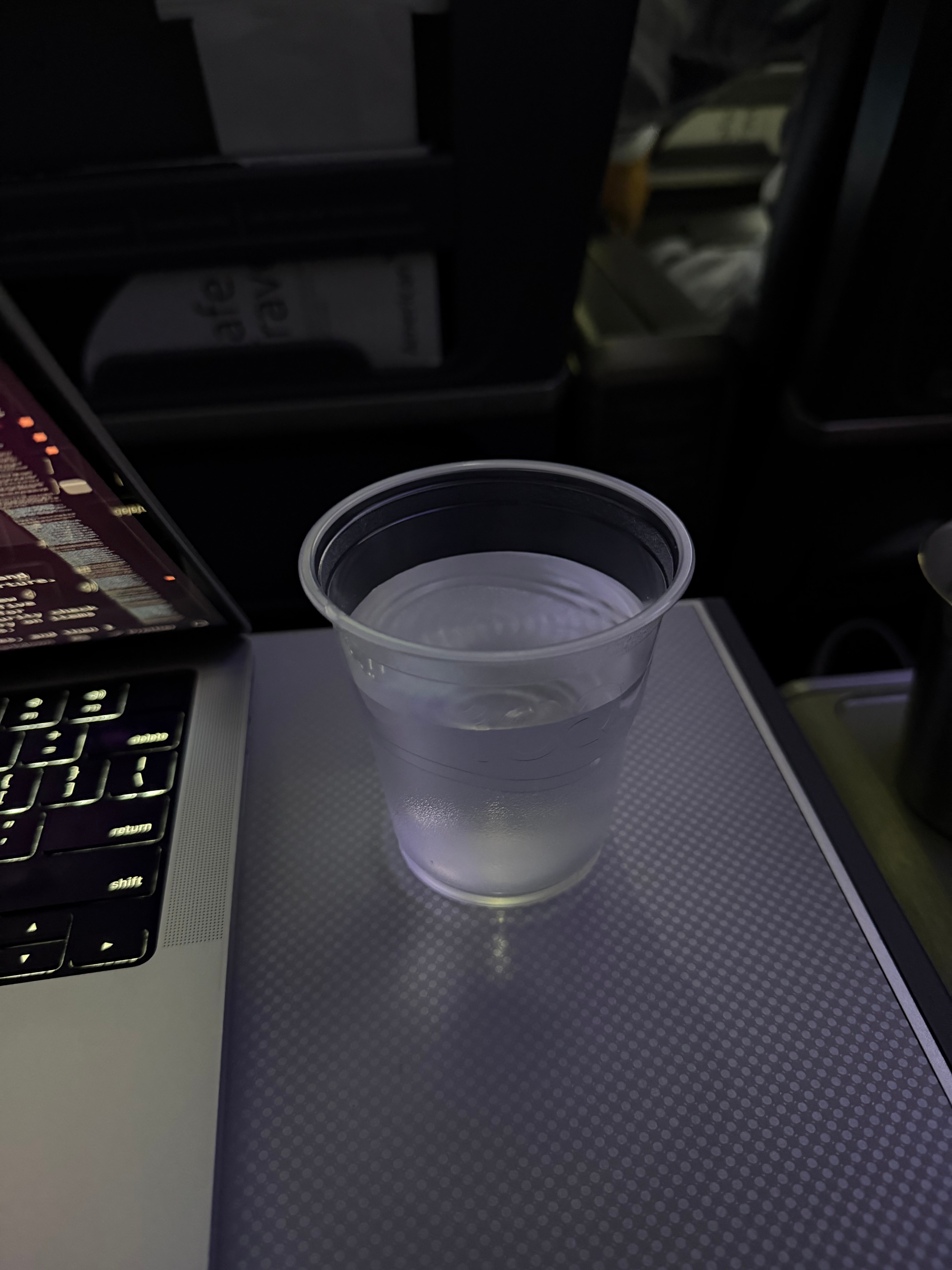 Glass of water during the second drink service on American Airlines.