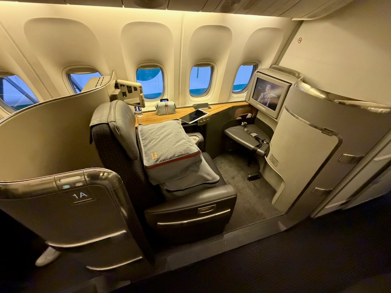 Flagship First seat 1A at the window on the American 777-300ER.