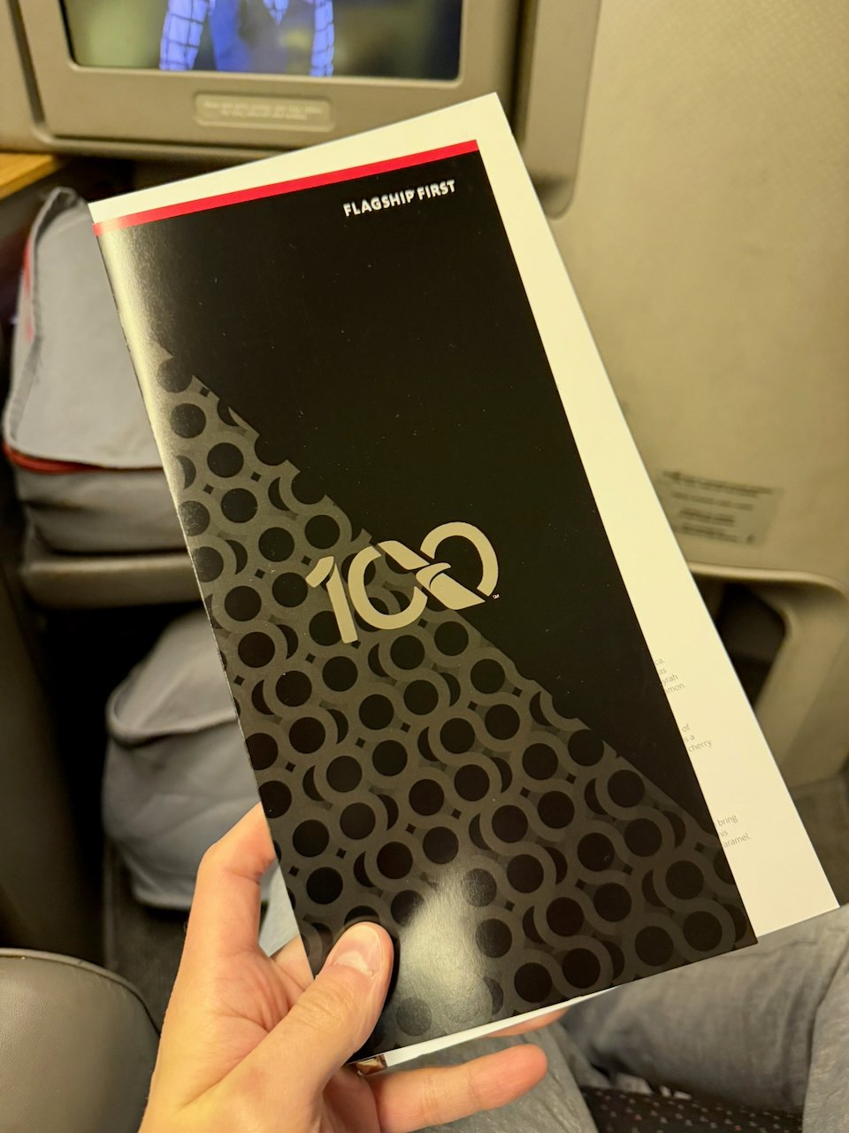 American Airlines Flagship First centennial 100 menu cover.