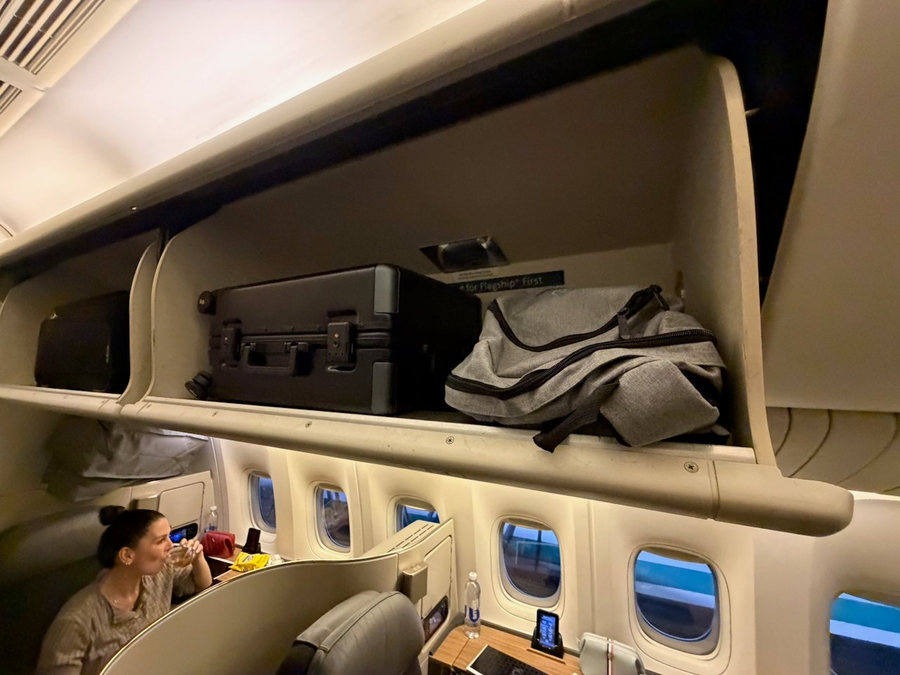 Overhead bins and Flagship First cabin on the American 777-300ER.