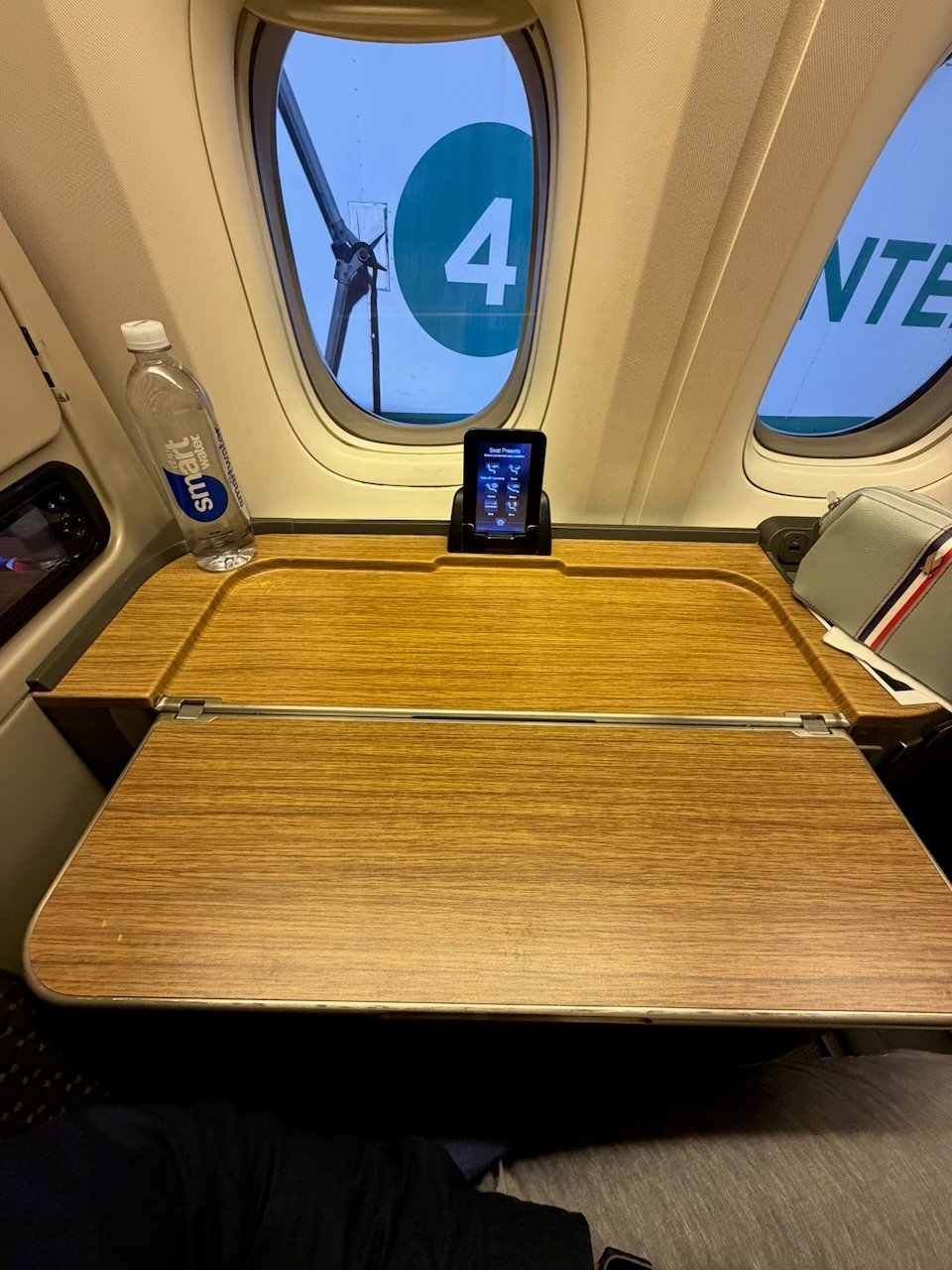 Tray table stowed in the American Flagship First side console.