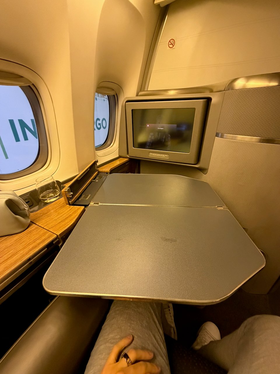 Tray table and legroom at the American Flagship First suite.