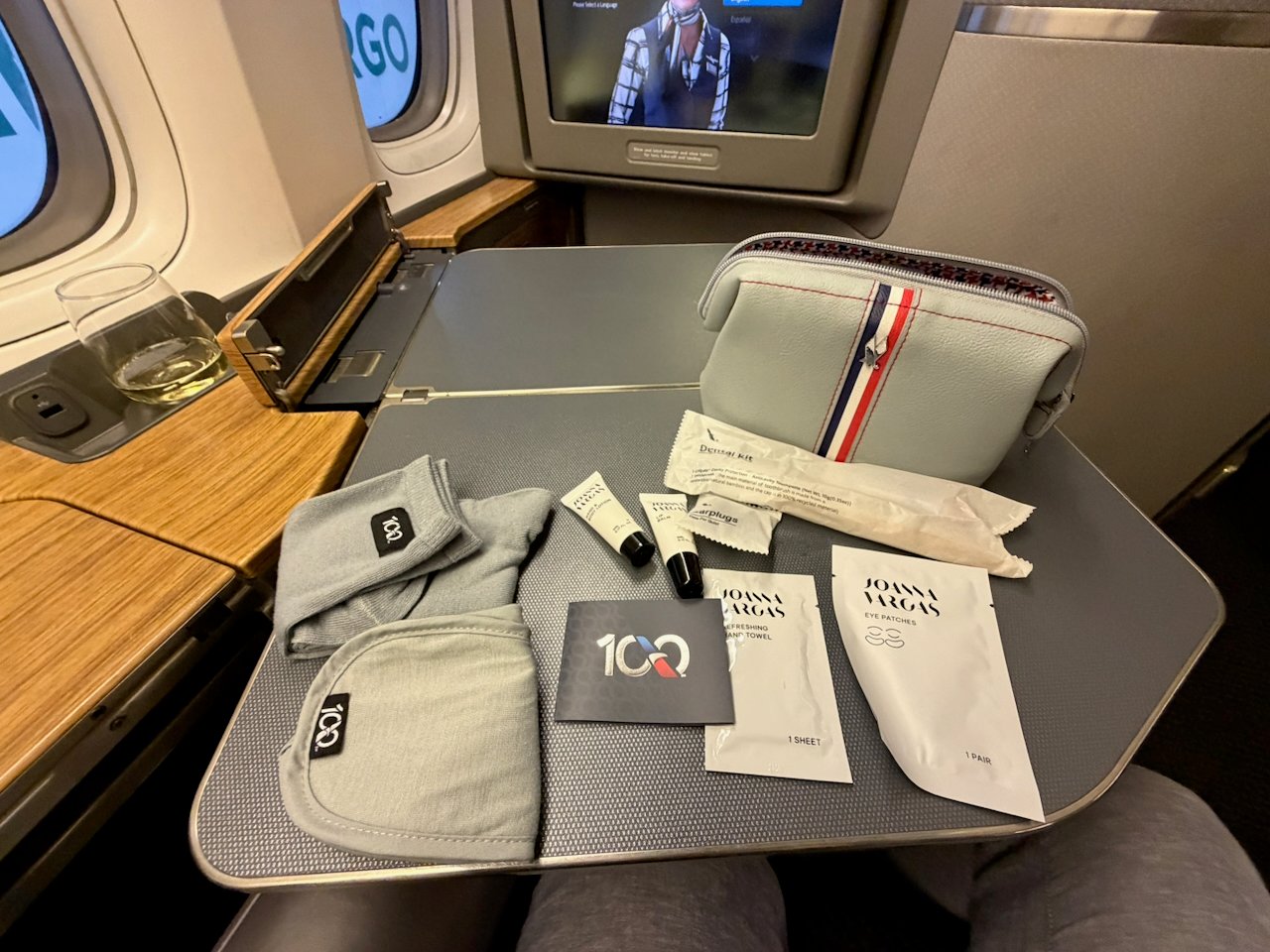 American Airlines centennial amenity kit items laid out on the tray.