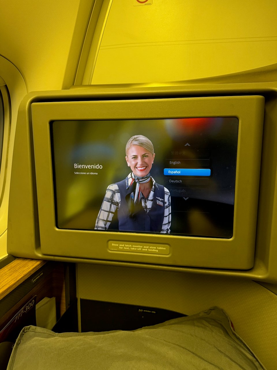 Close-up of the IFE welcome screen on the American 777.