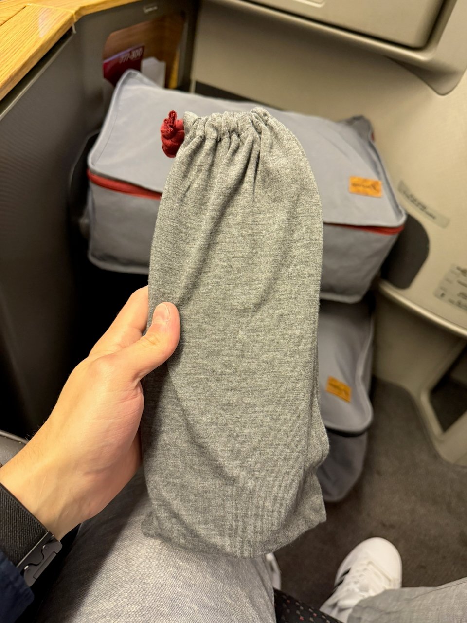 Slippers bag at the American Flagship First seat.
