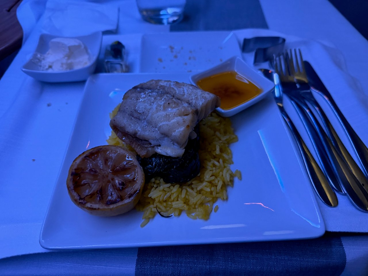 Close-up of the pan-seared congrio main course in American Flagship First.