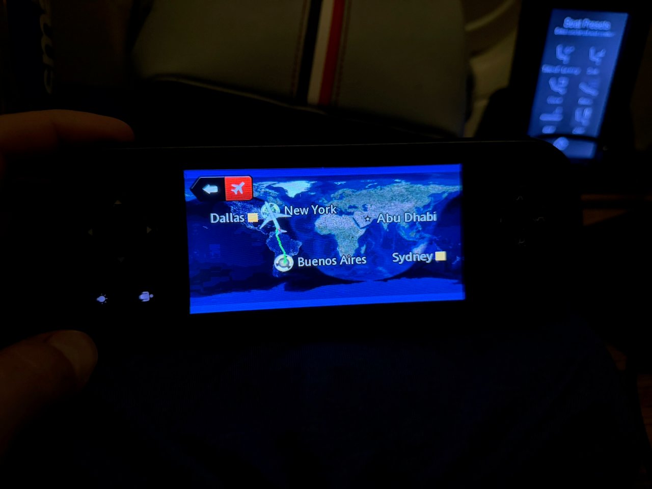 Handheld IFE controller showing the flight map in Flagship First.