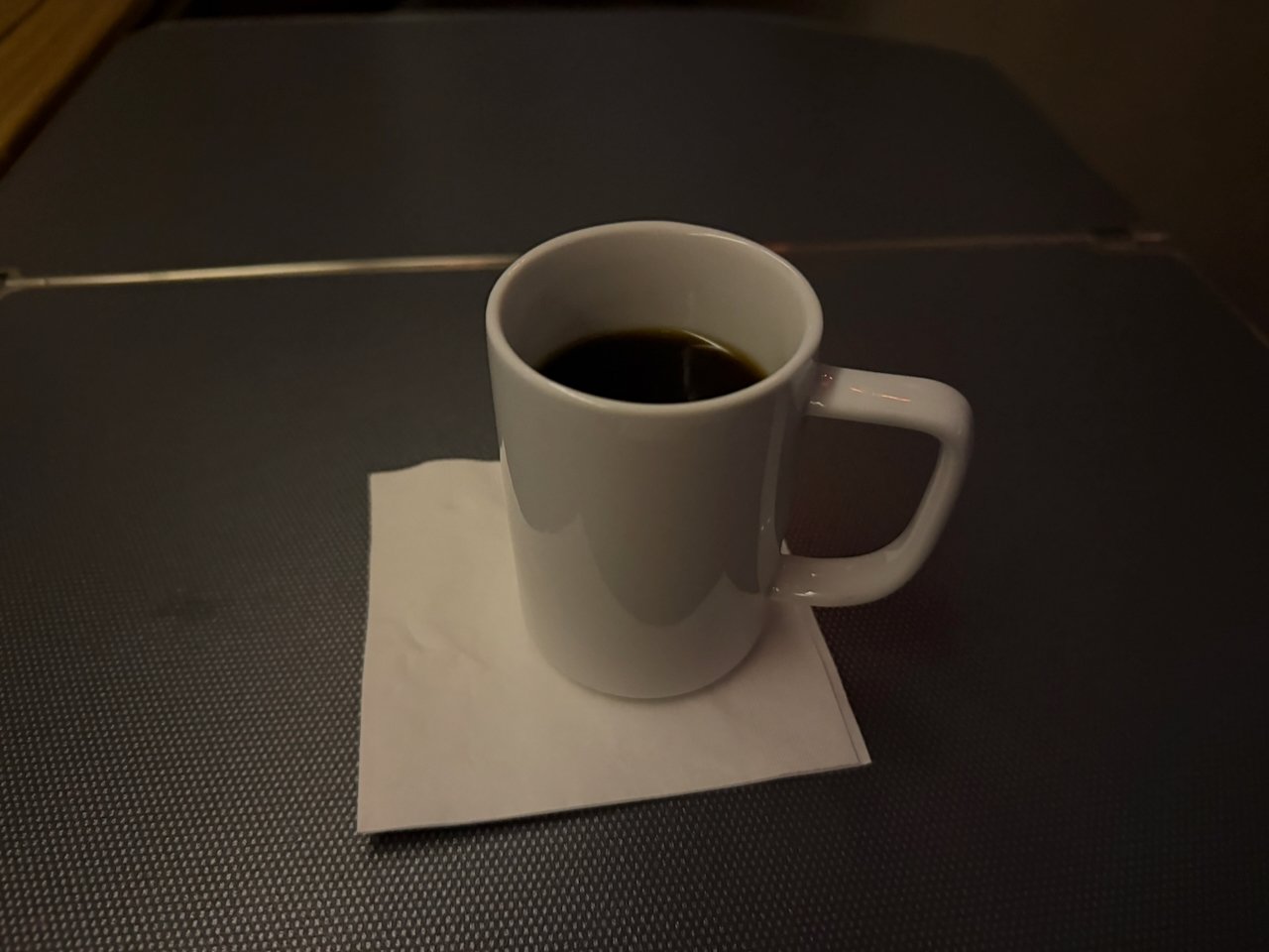 Pre-arrival coffee in American Airlines Flagship First.