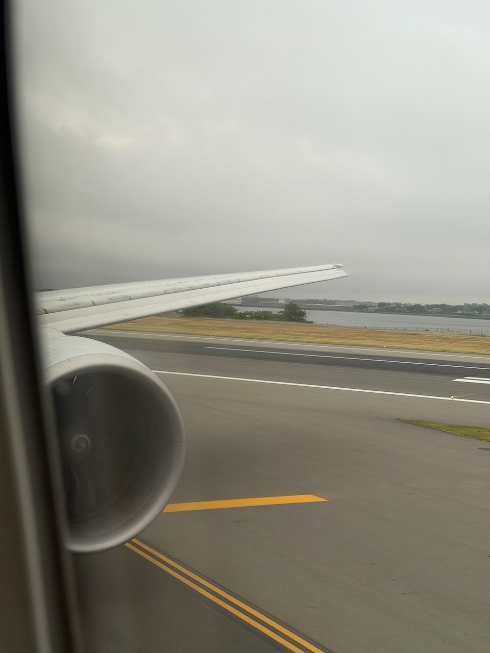 Window view of the runway on landing at New York JFK.