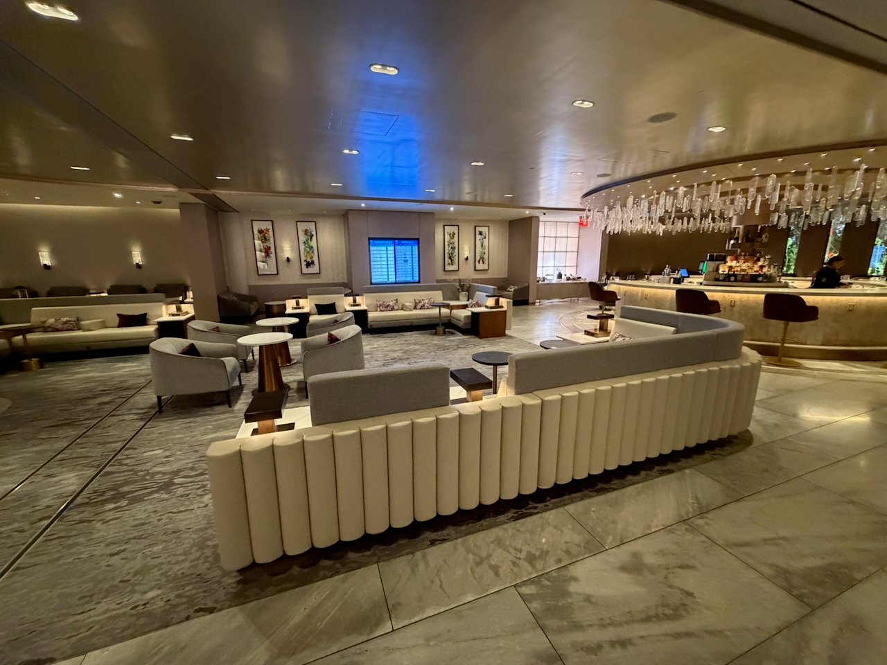 Seating and bar area at the JFK Chelsea Lounge.