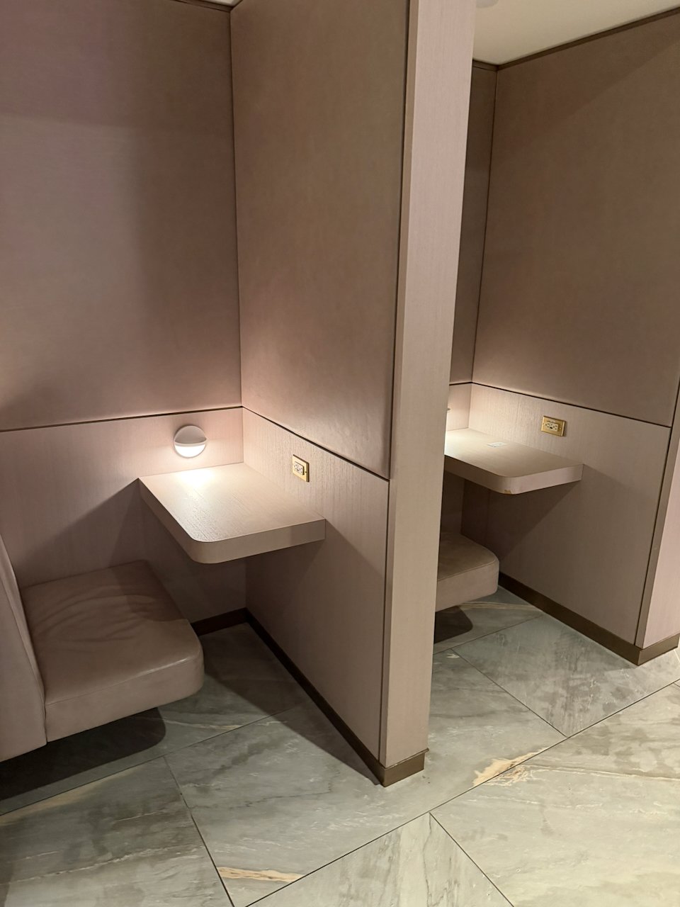 Private booths at the Chelsea Lounge in JFK Terminal 8.