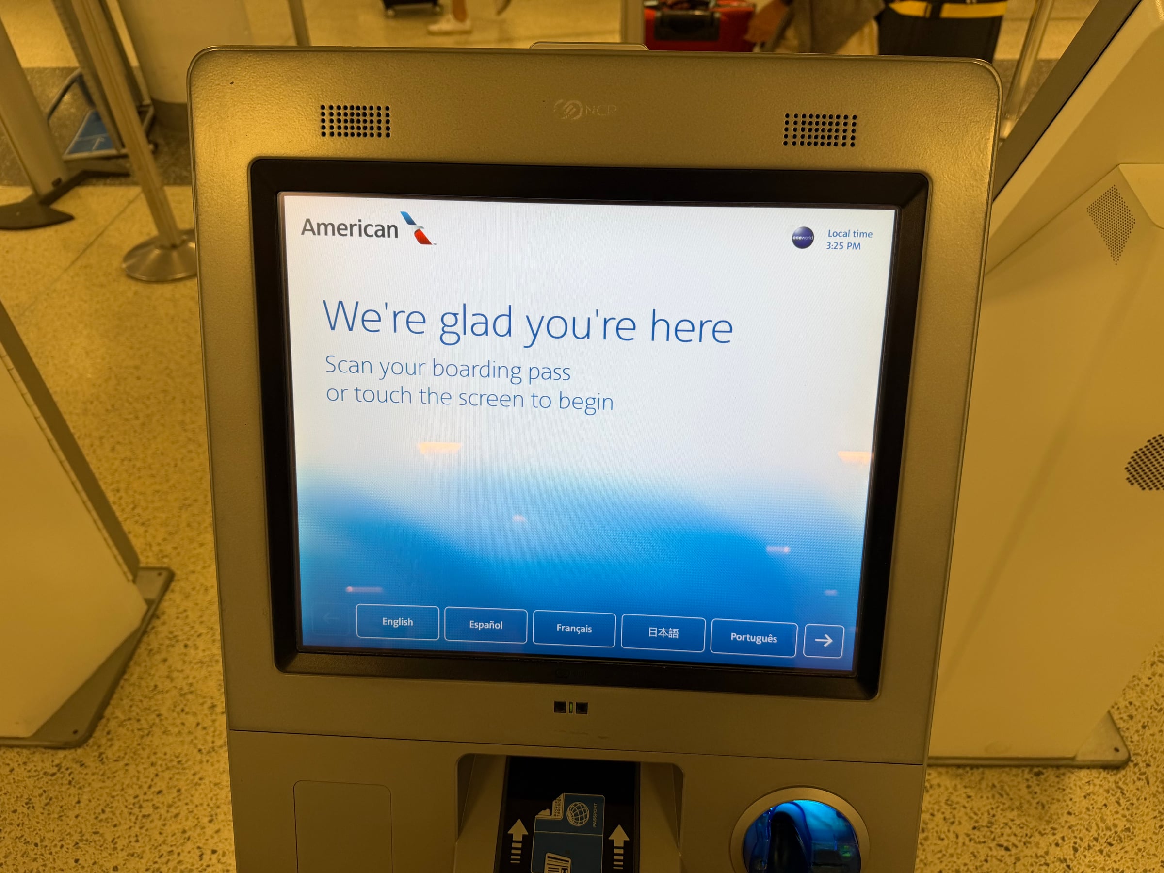 American Airlines self-service check-in kiosk at Boston Logan before the connecting flight to JFK.