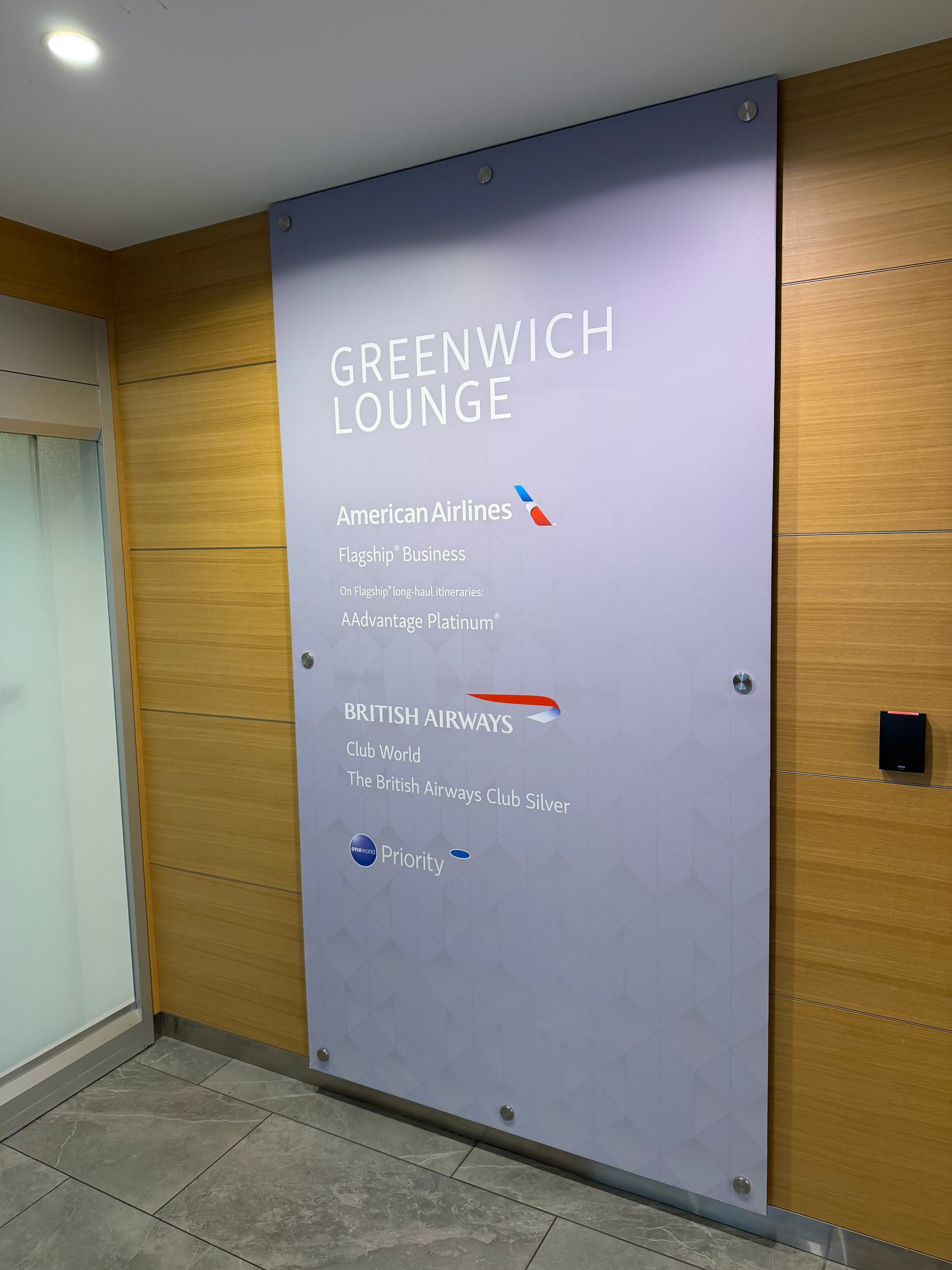 Entrance sign for the Greenwich Lounge at JFK Terminal 8.