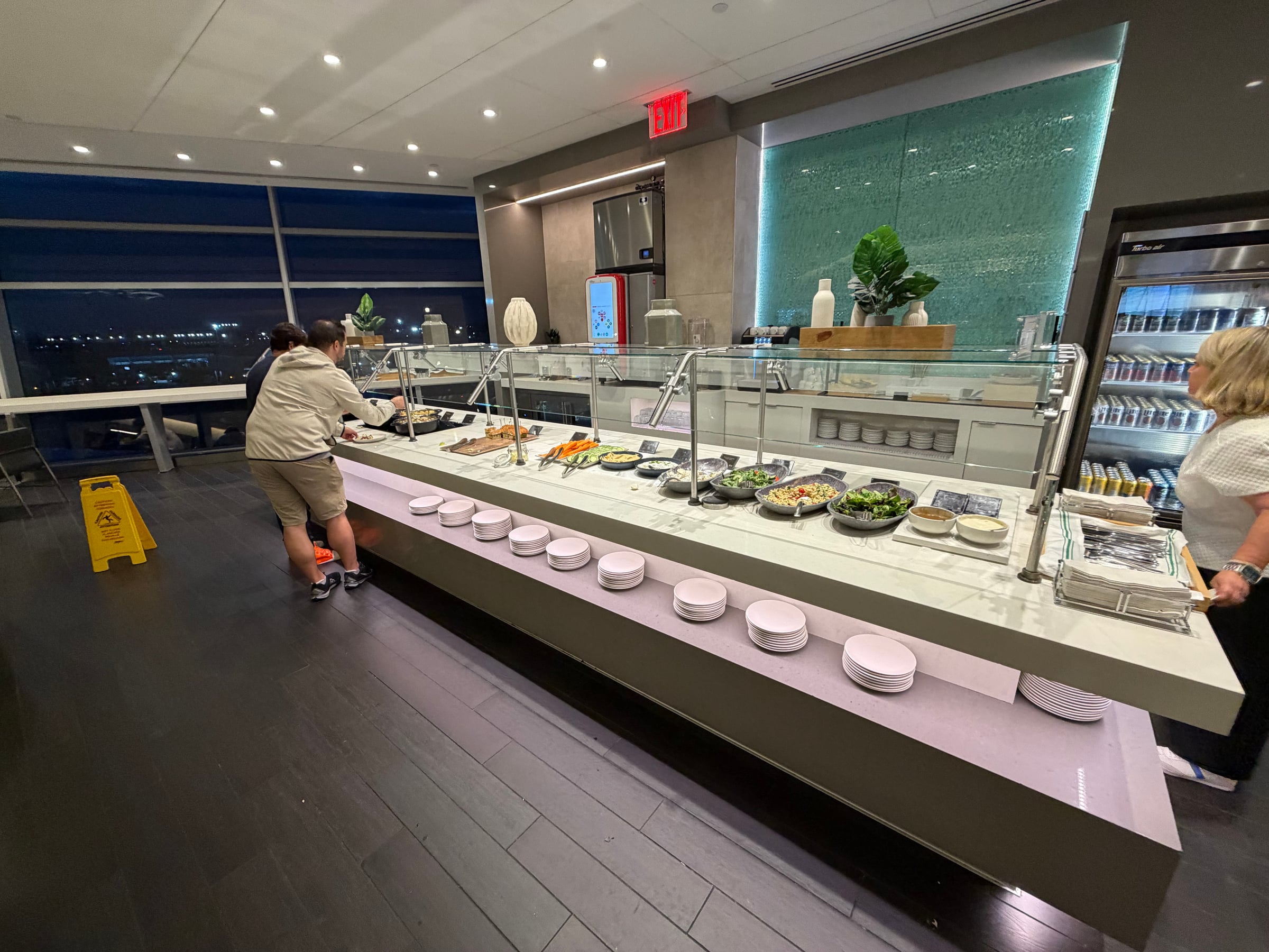 Buffet counter with hot and cold dishes in the JFK Greenwich Lounge.