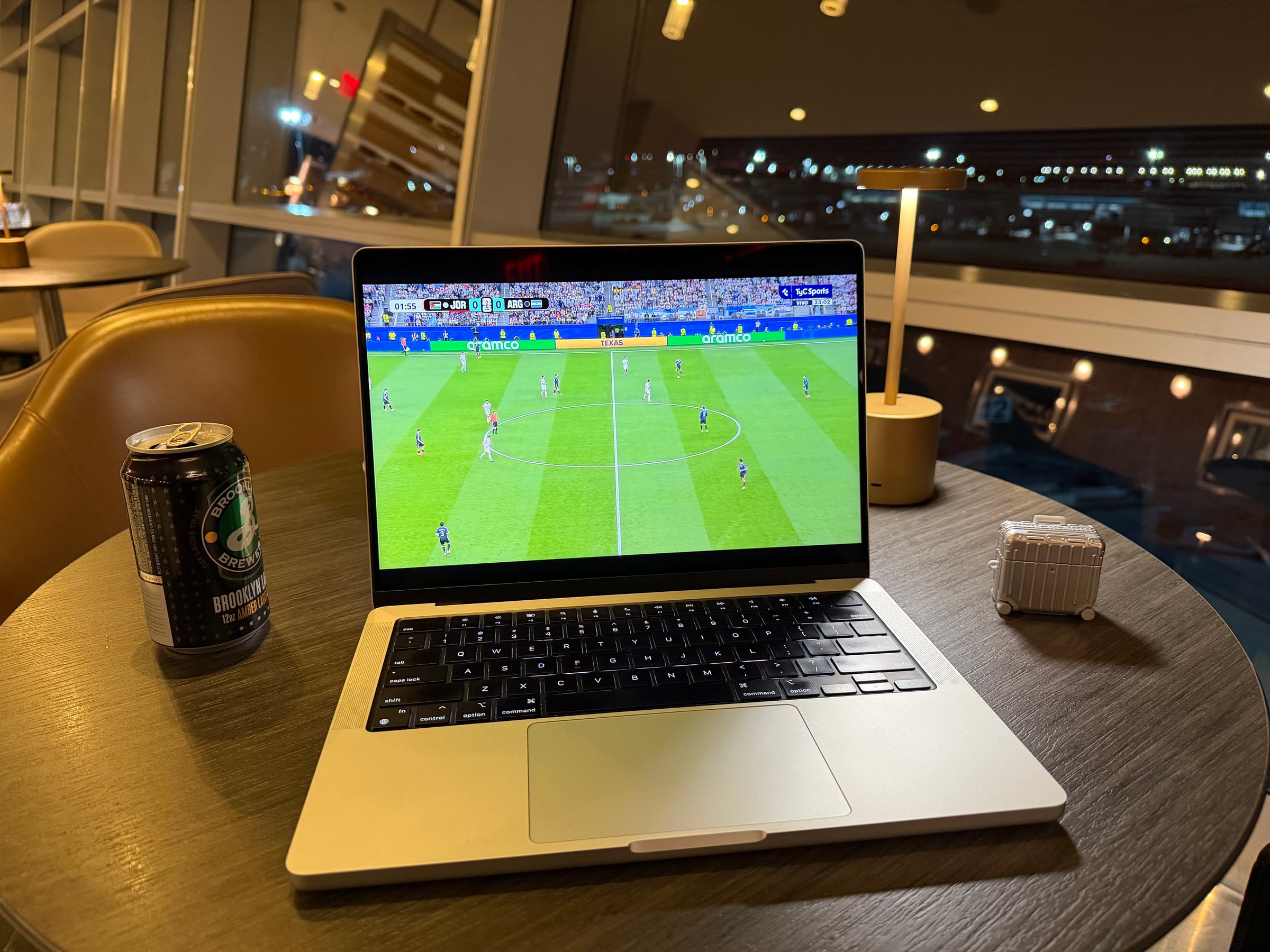 Watching a FIFA World Cup match on a laptop beside the windows in the Greenwich Lounge.