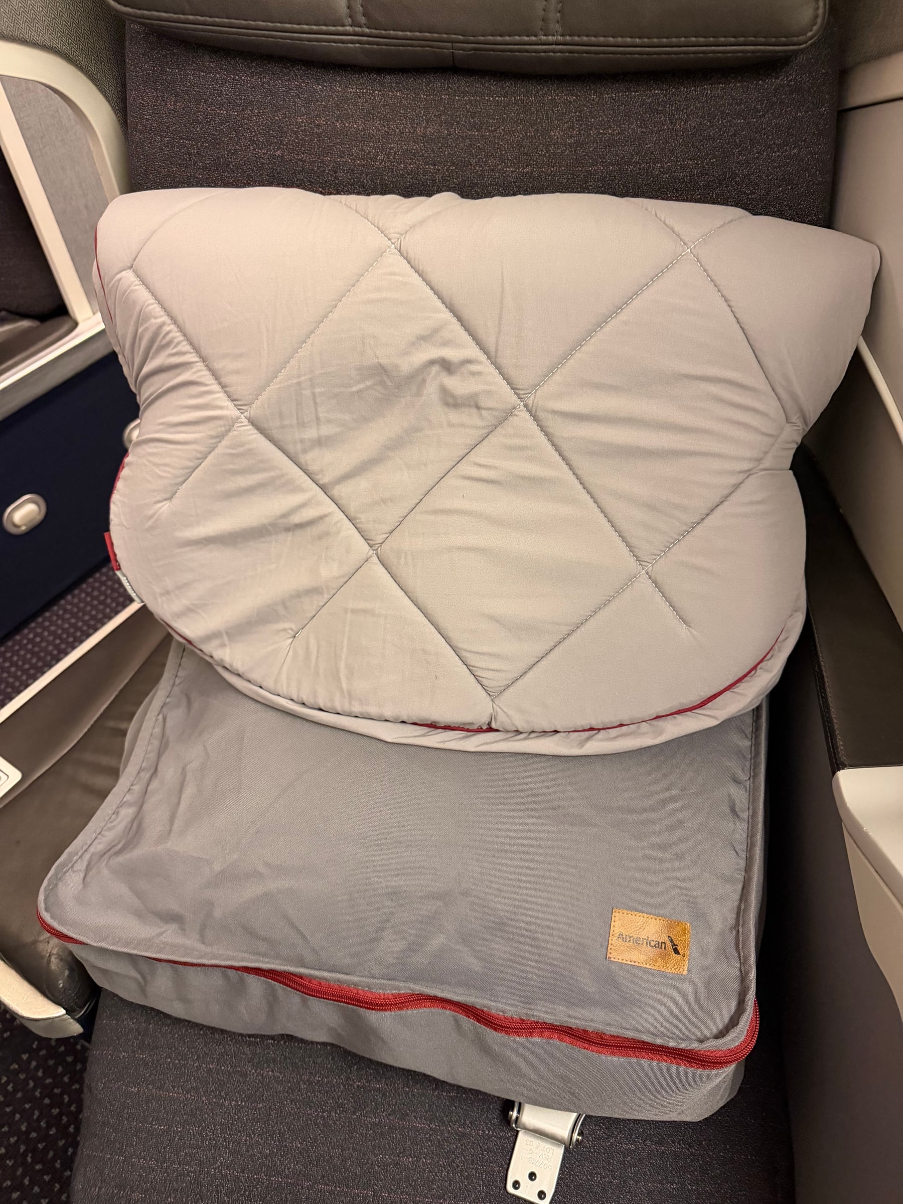Mattress pad provided at the American Airlines Business Class seat.