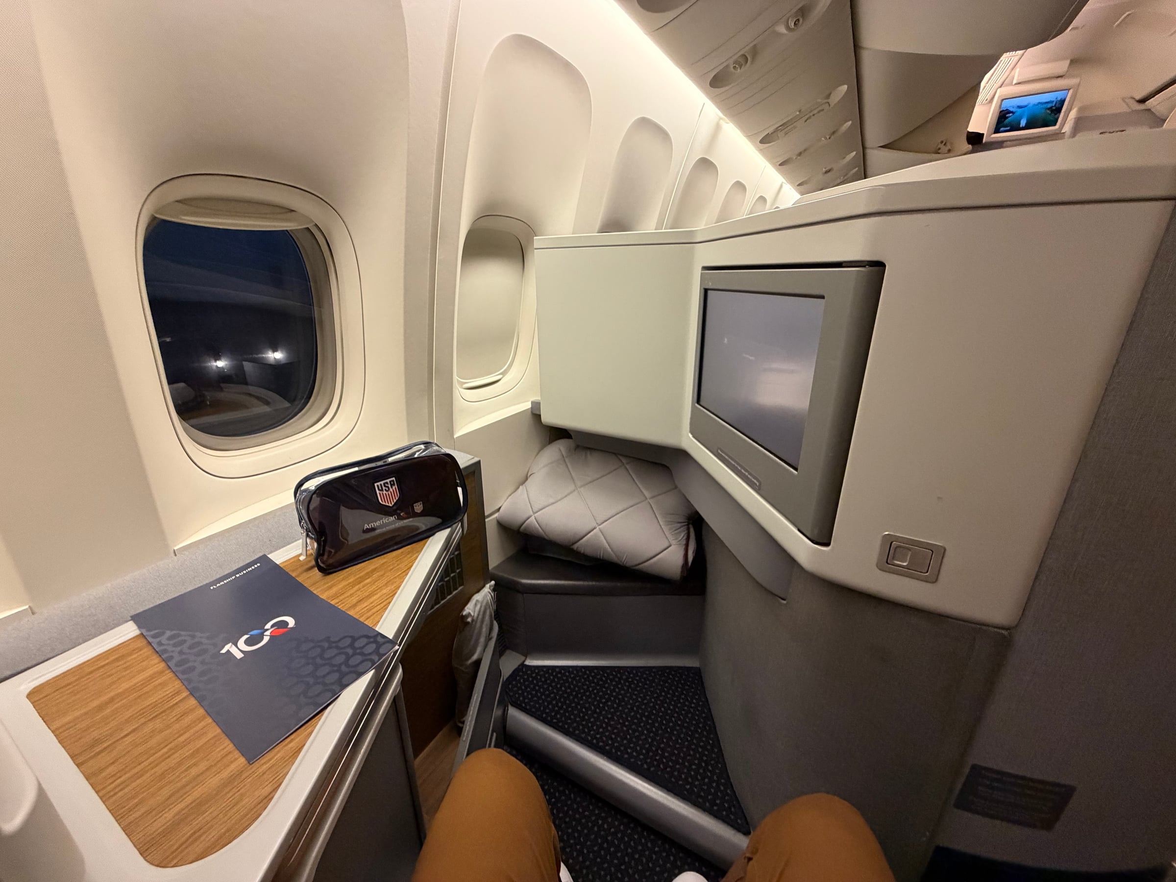 Wide view of American Airlines Flagship Business seat 9A and its IFE screen.