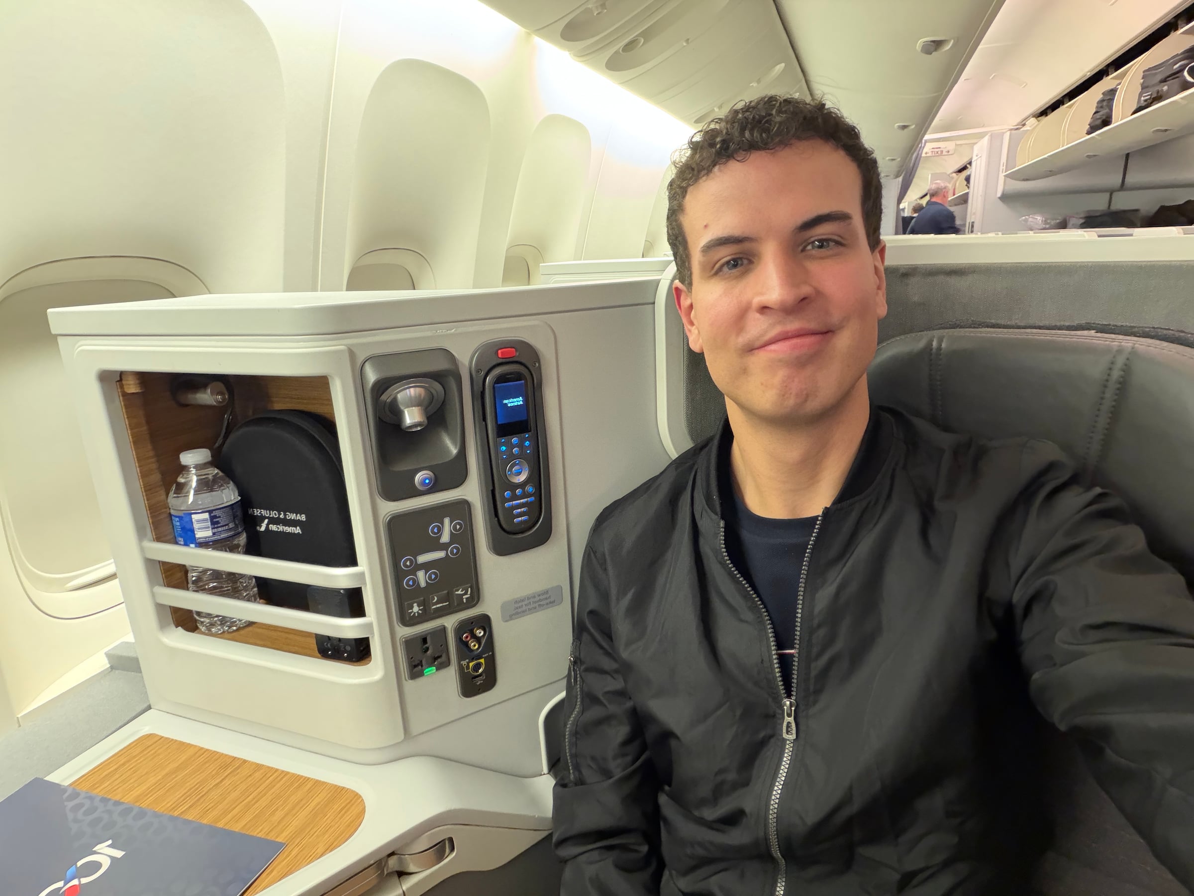 Author seated in American Airlines Flagship Business seat 9A.