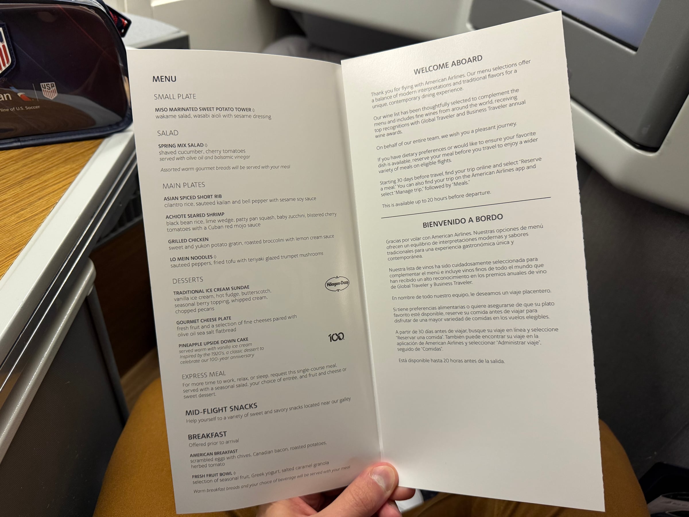 American Airlines Flagship Business dinner and breakfast menu opened at the seat.