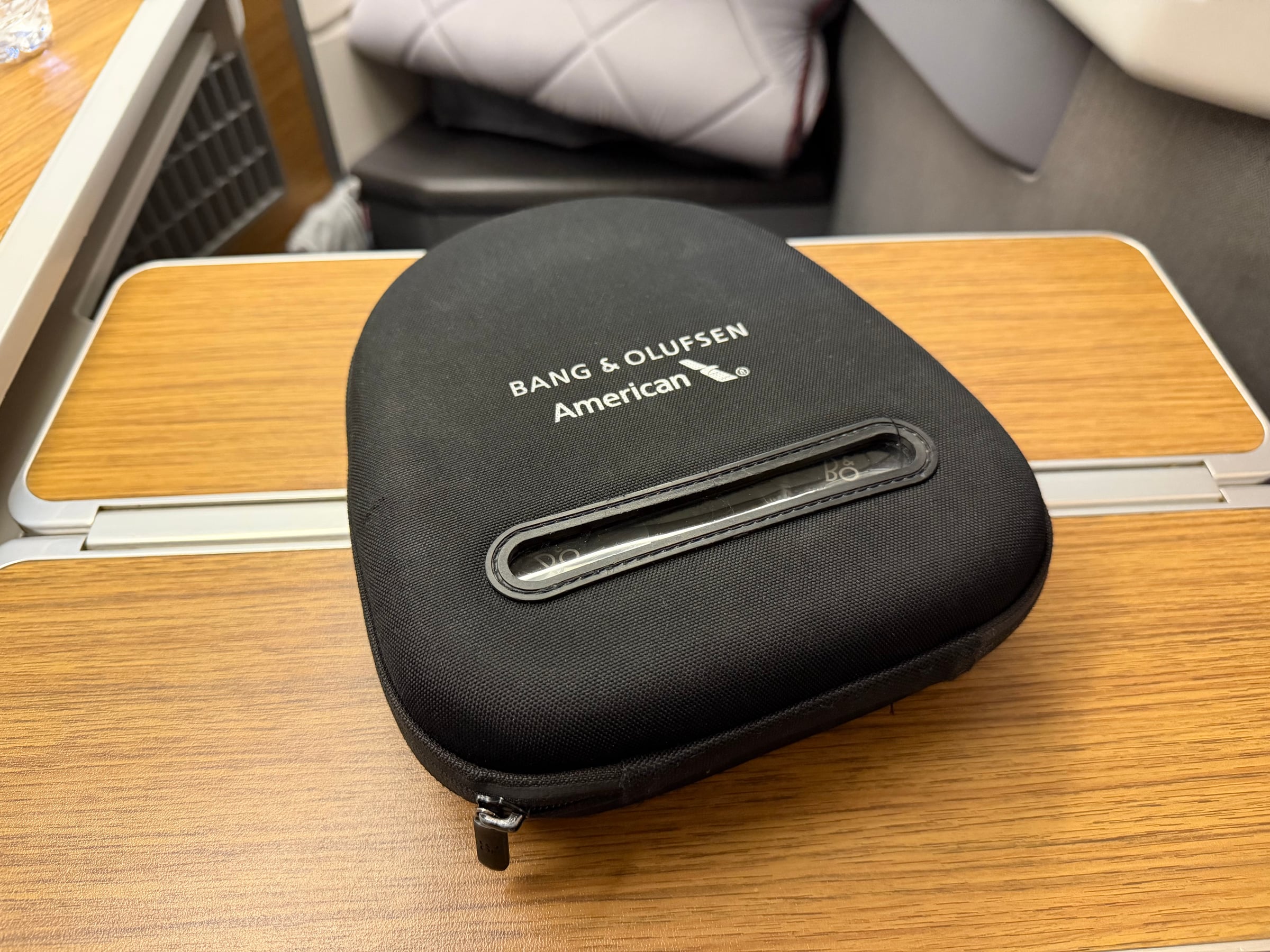 Bang and Olufsen noise-canceling headphones case in American Airlines Flagship Business.