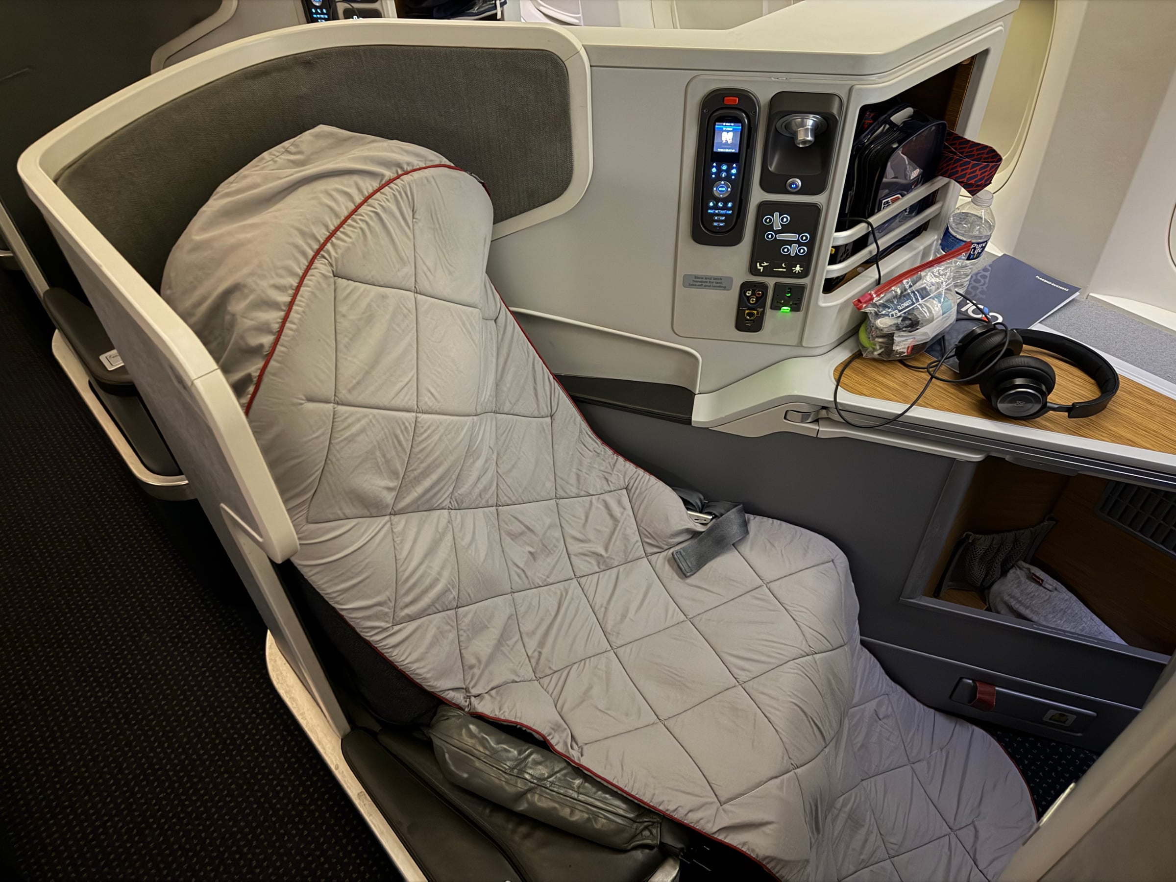 American Airlines 777 Business Class seat prepared with the mattress pad.