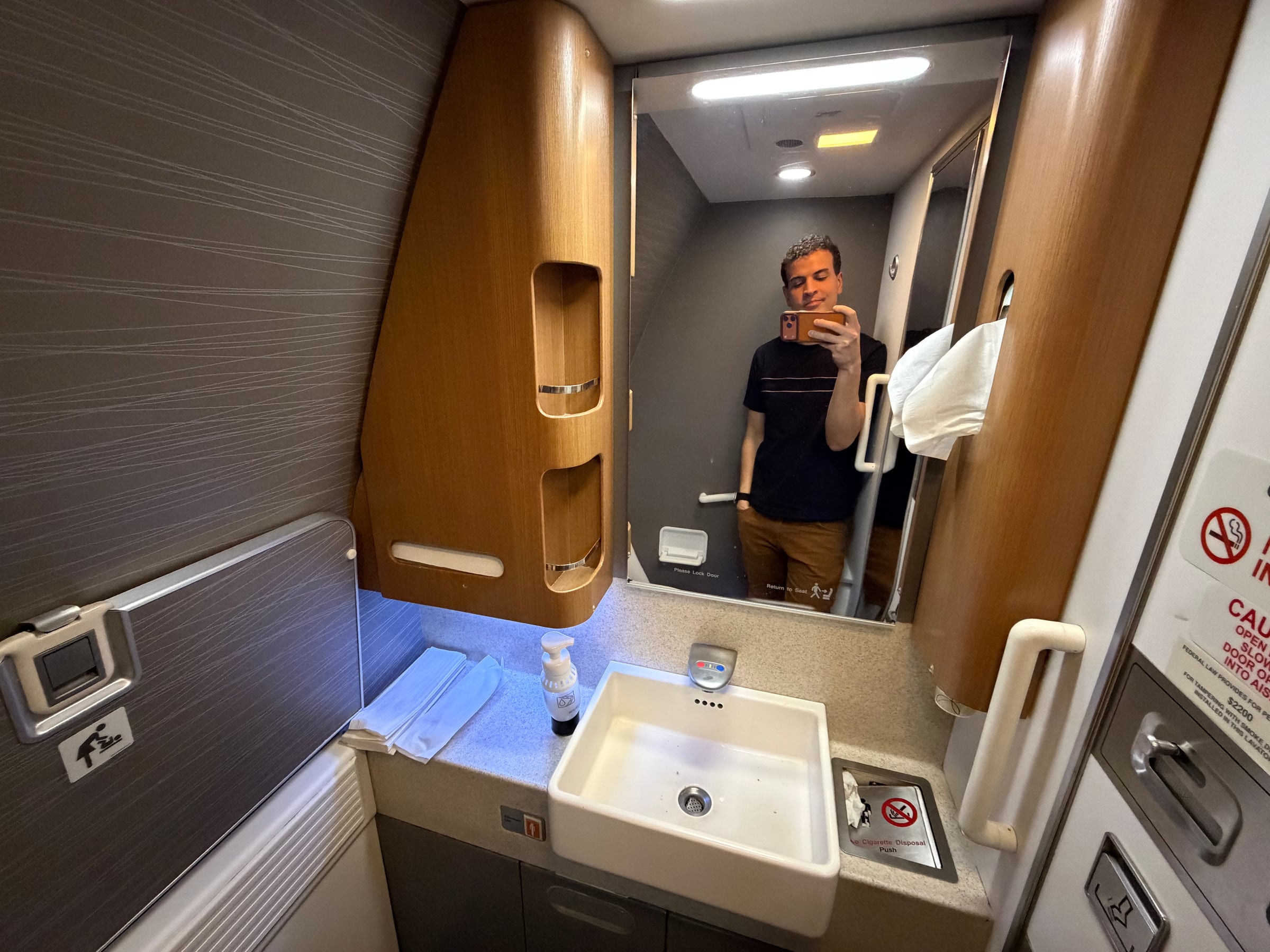 Mirror and vanity inside an American Airlines 777 Business Class lavatory.