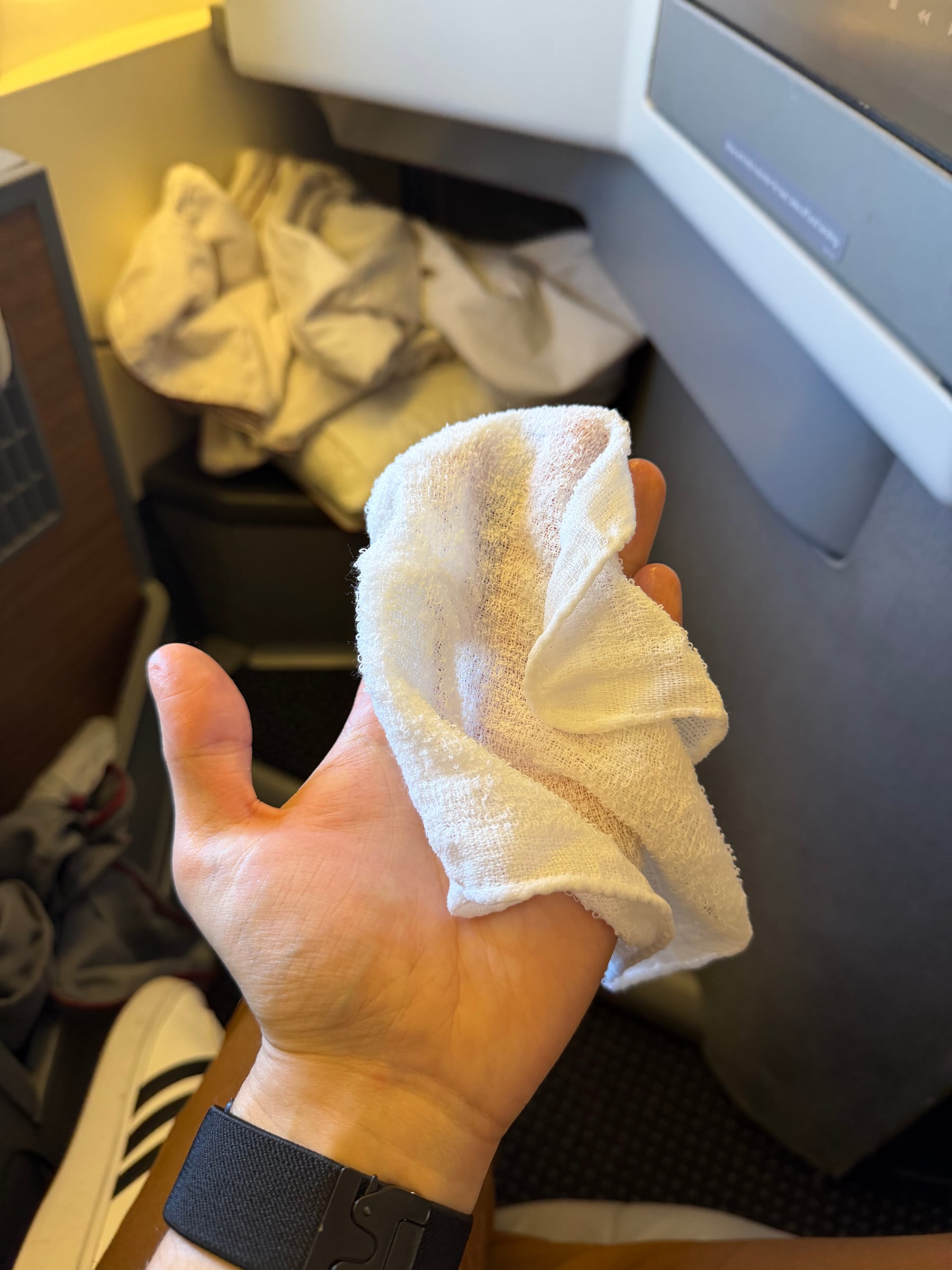 Pre-arrival hot towel offered before breakfast in American Flagship Business.