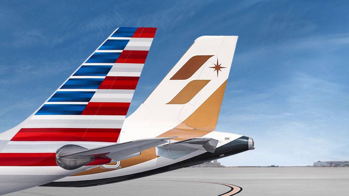 American Airlines and STARLUX Airlines aircraft tails side by side.