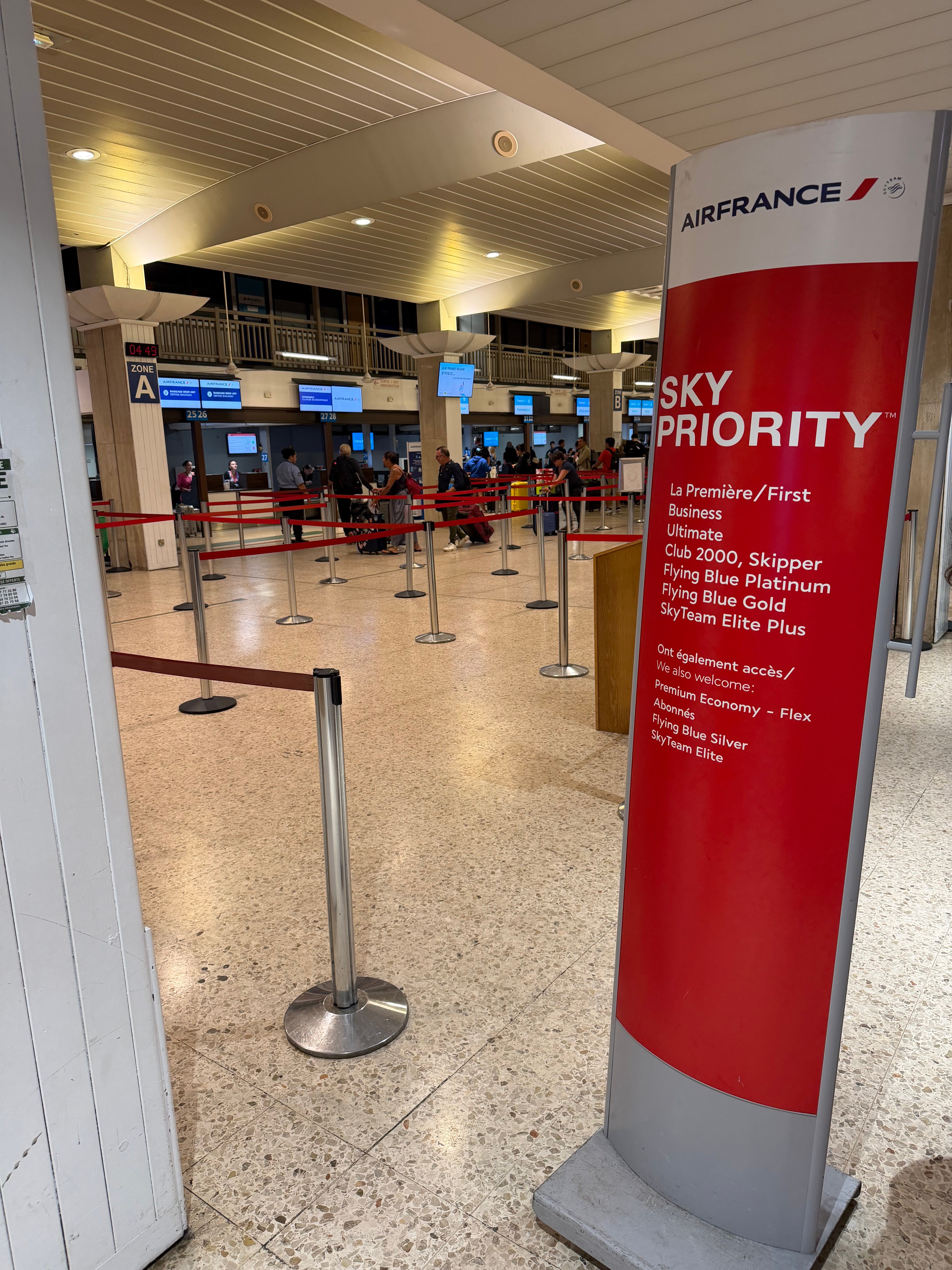 SkyPriority sign and Air France check in lane in Papeete.