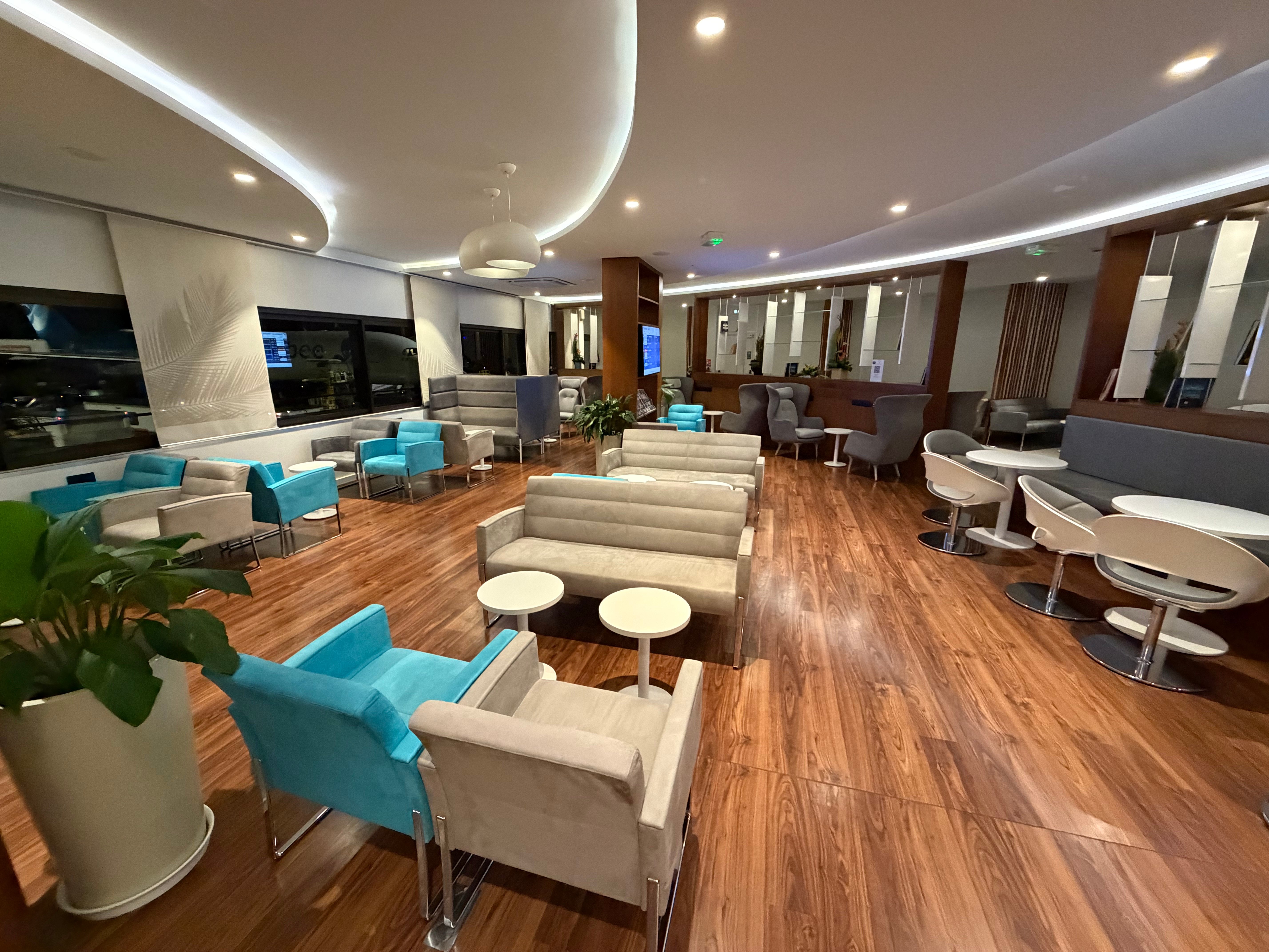 Lounge seating with tables between the chairs.