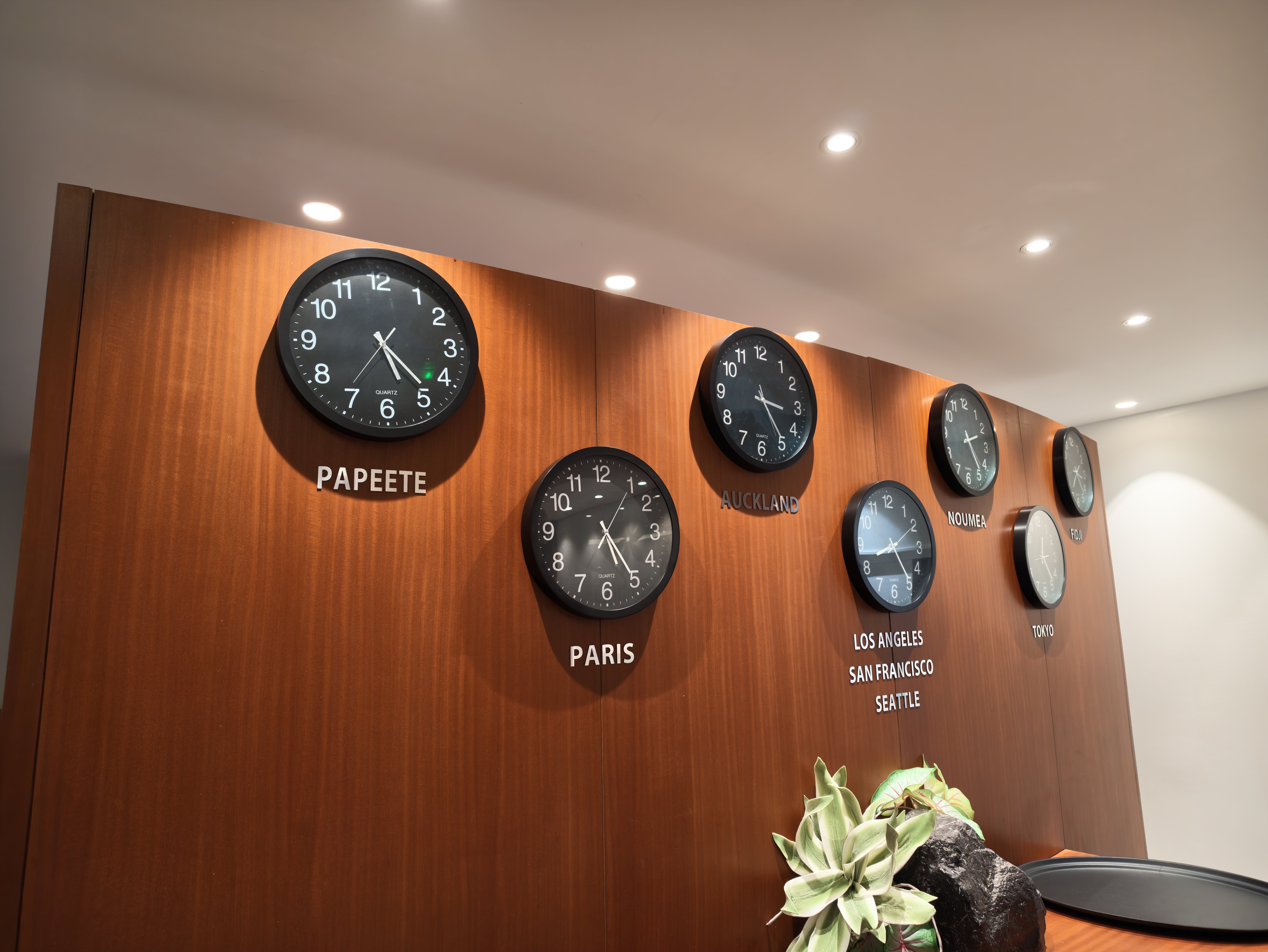 Clocks showing different time zones inside the lounge.
