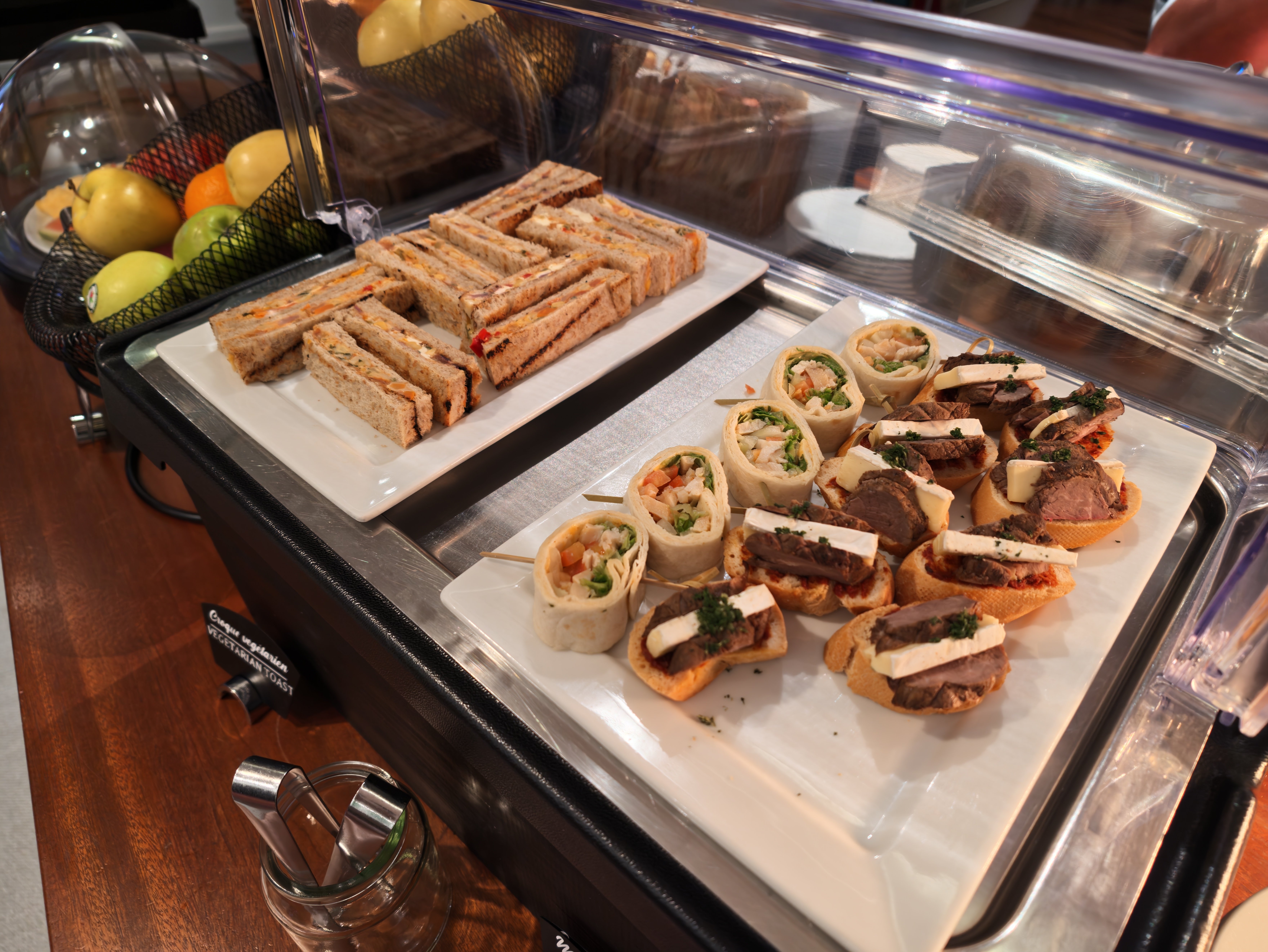 Small sandwiches and canapes on the lounge buffet.