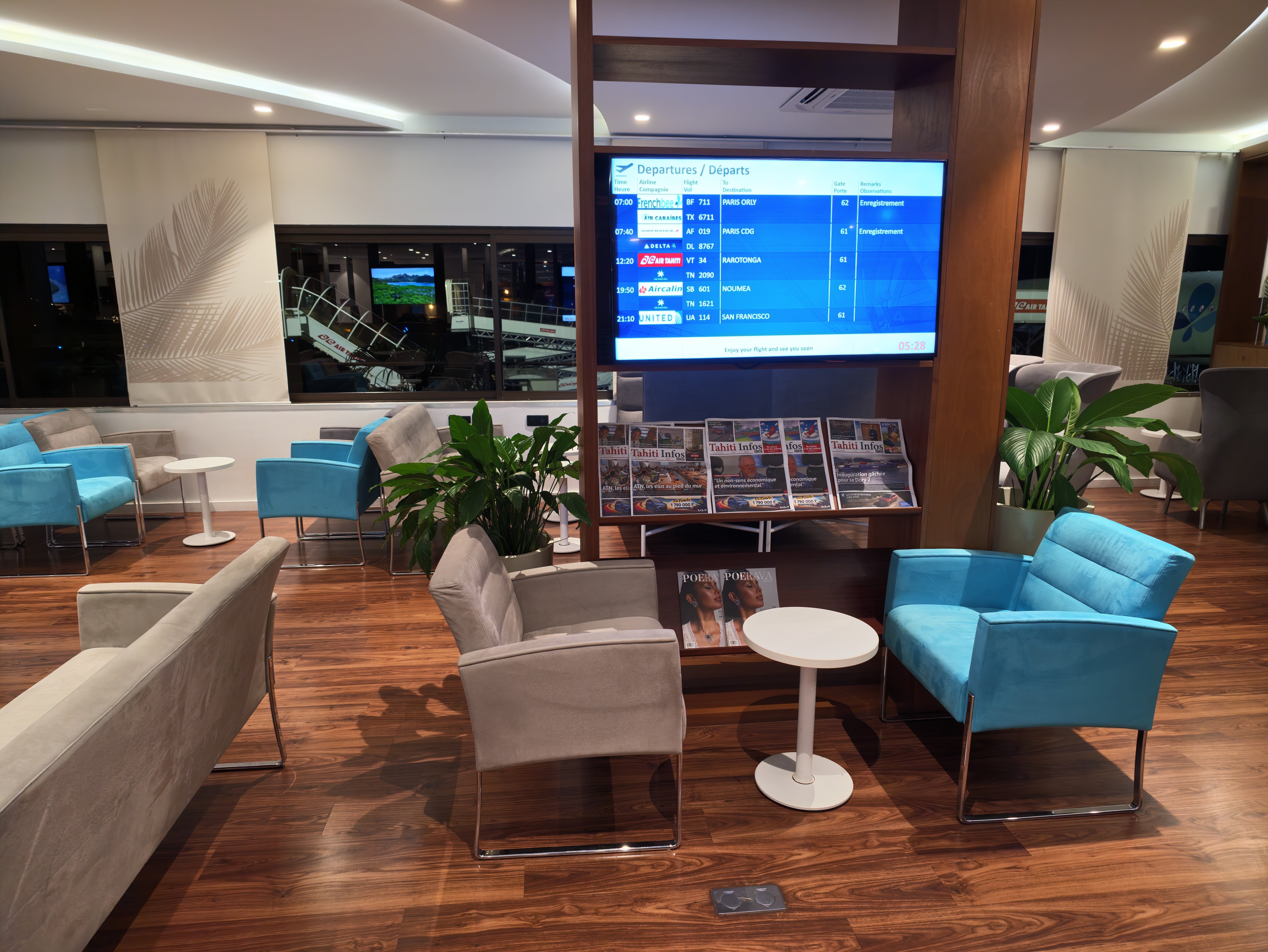 Flight information screen inside the lounge.
