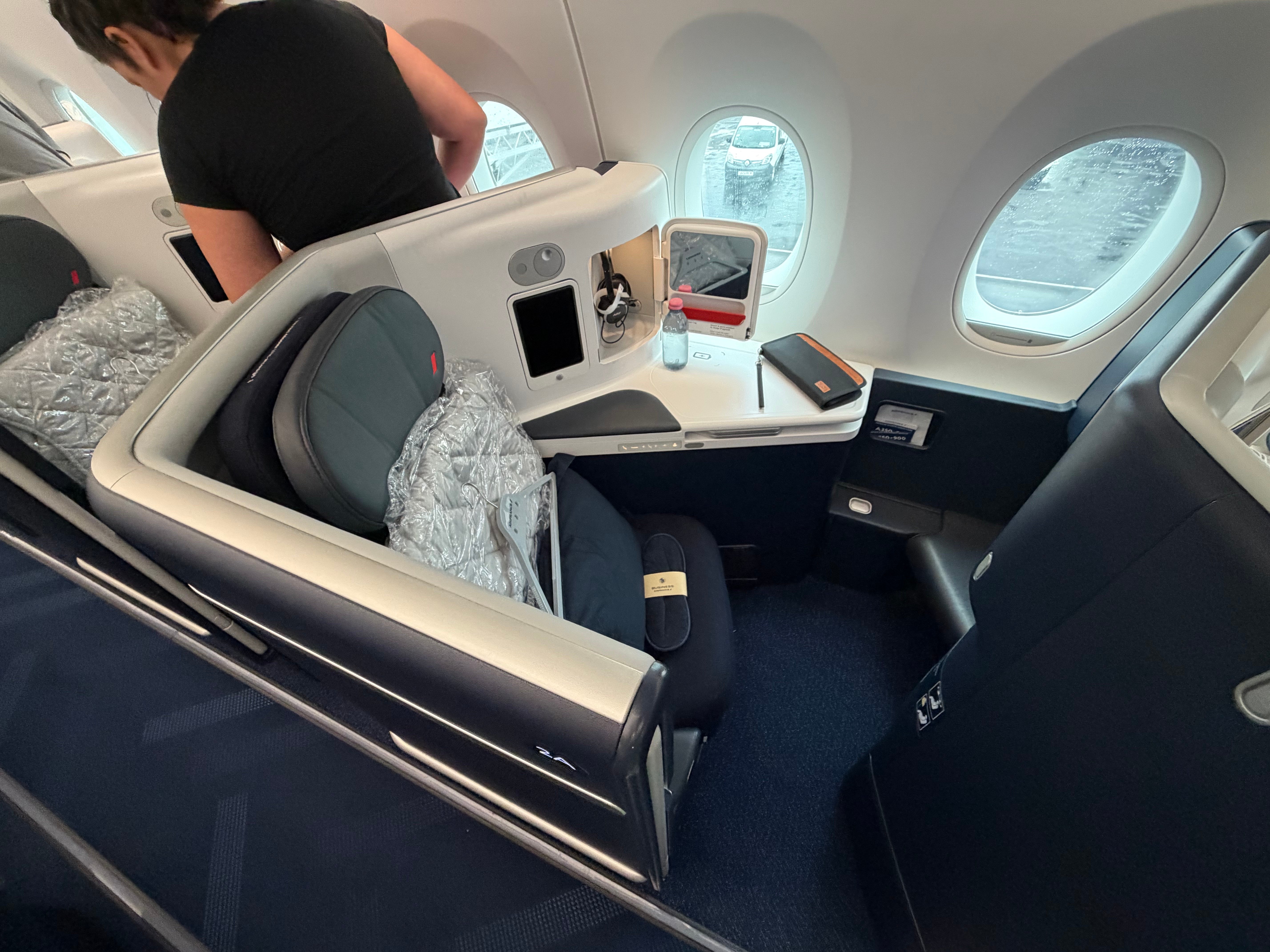 Business Class seat with bedding ready for the passenger.