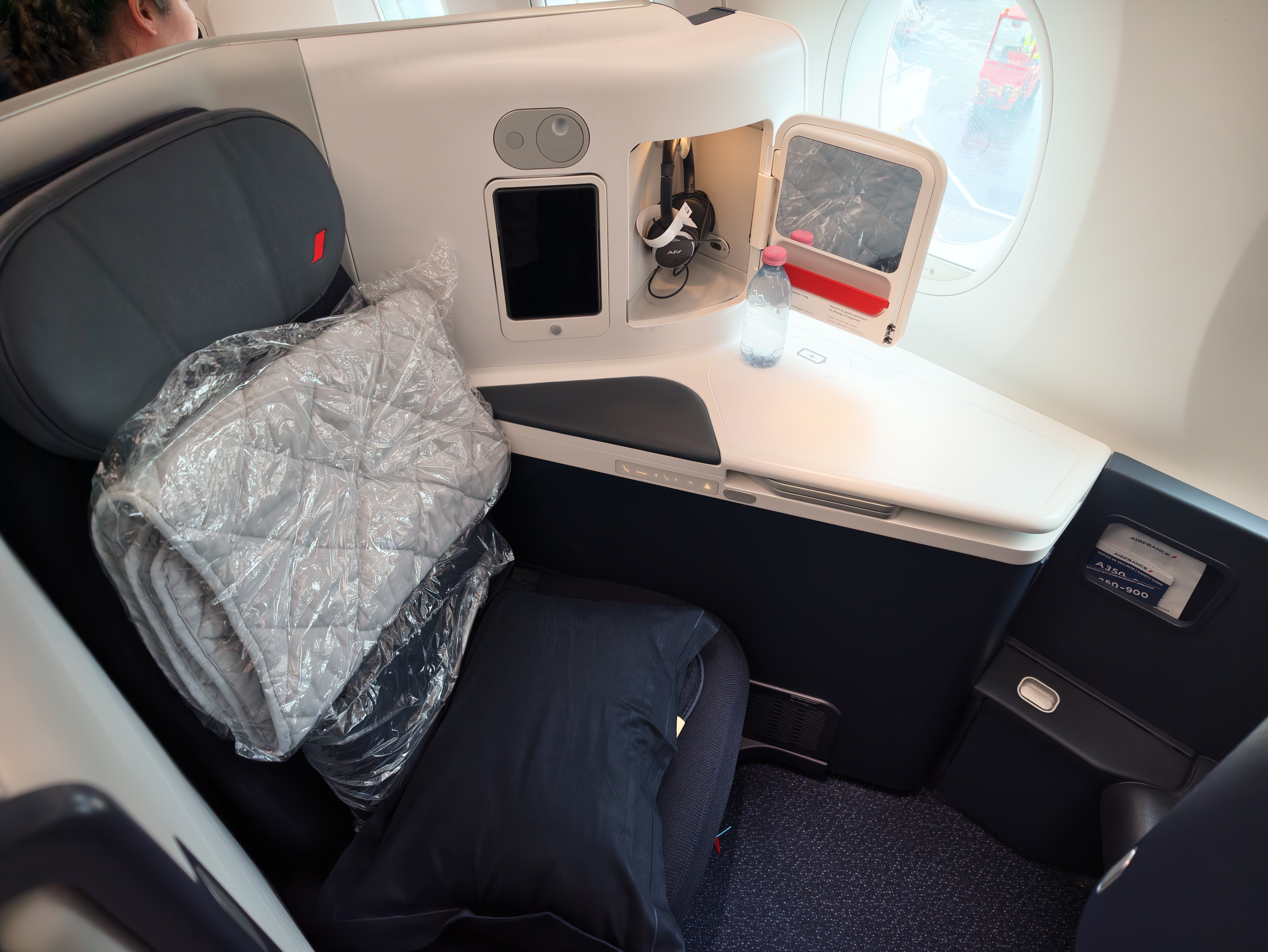 Air France Business Class seat with a pillow.