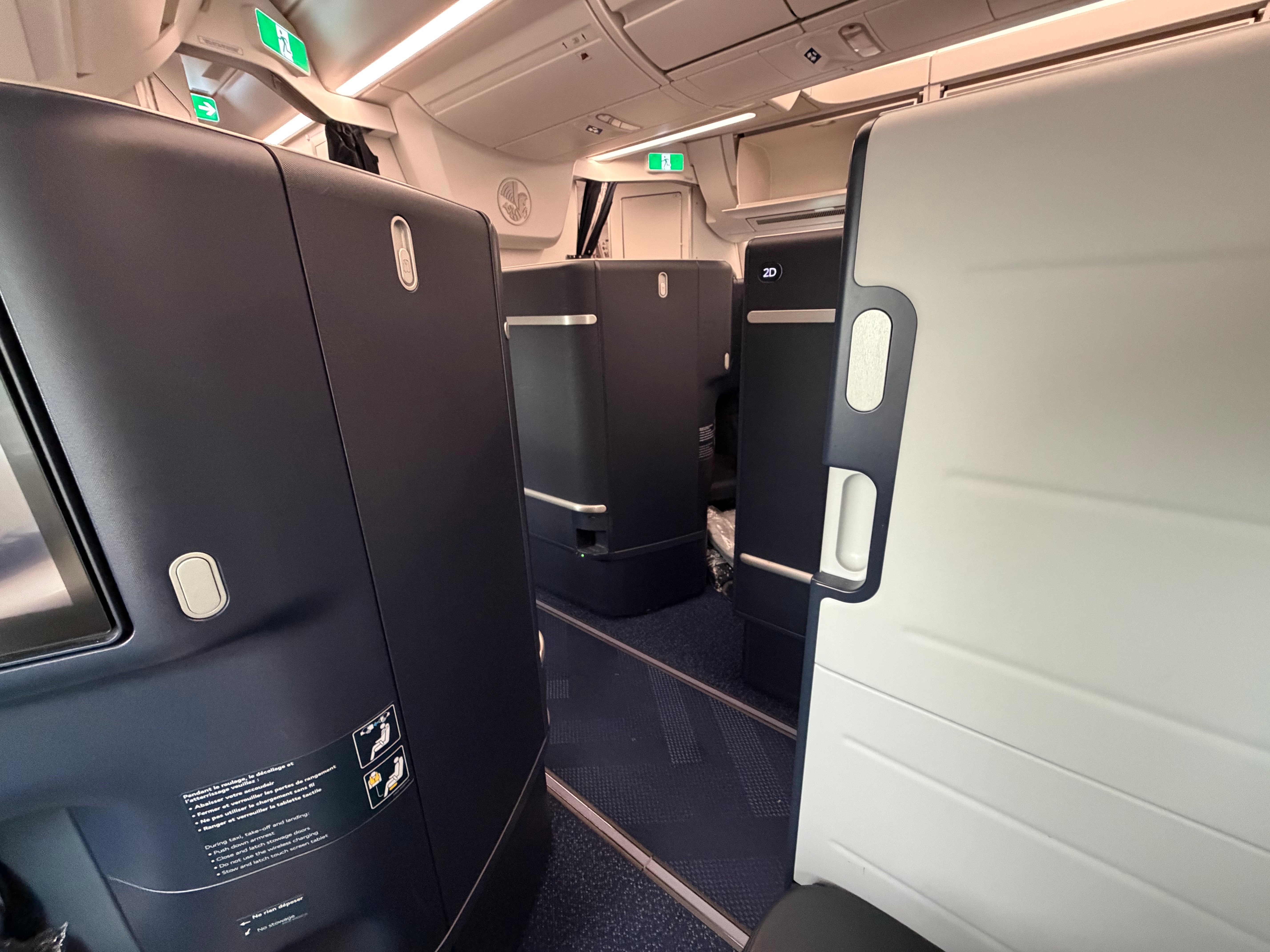 Tall privacy walls between the Air France Business Class suites.