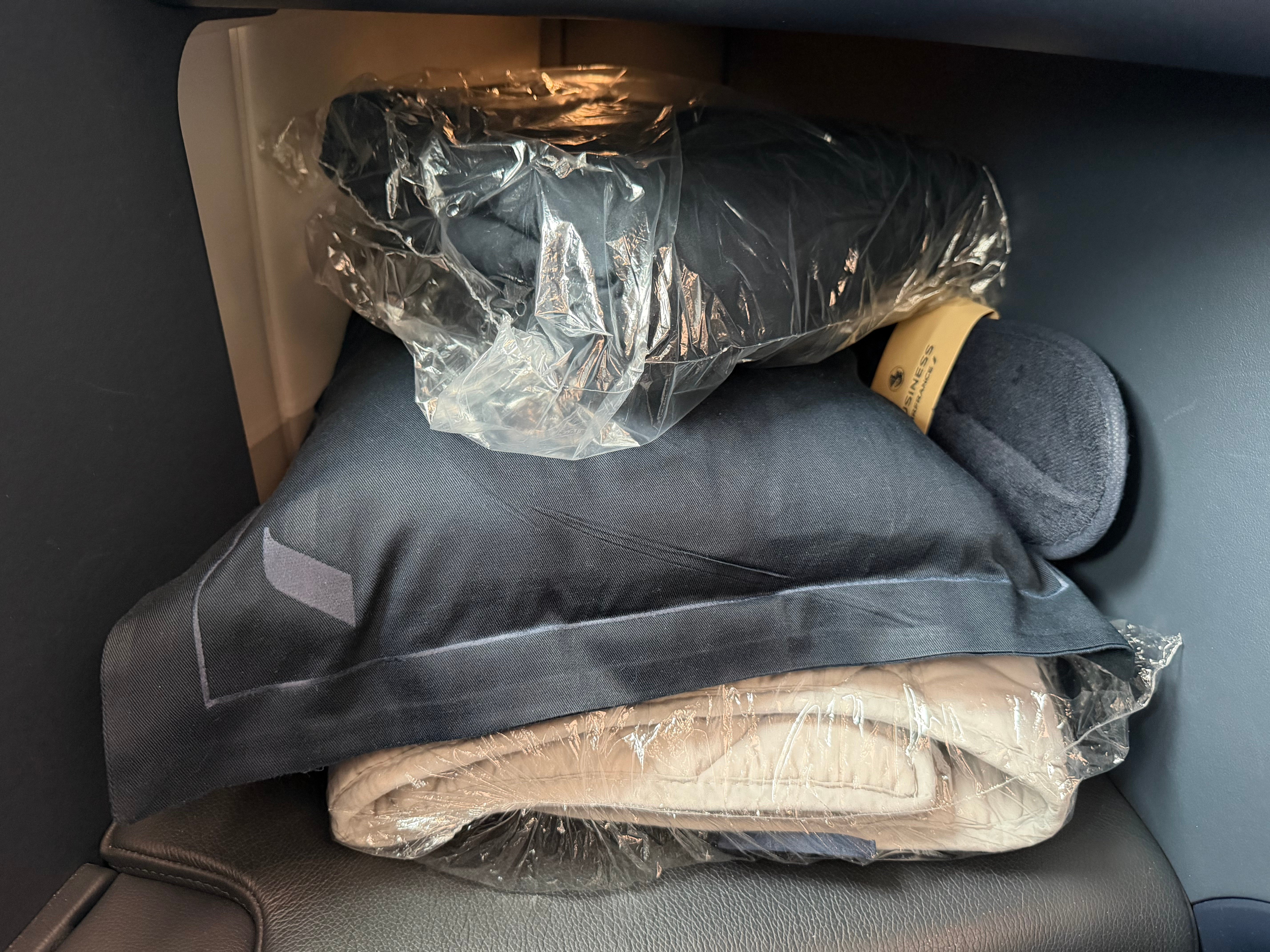 Bedding arranged in the Business Class suite.