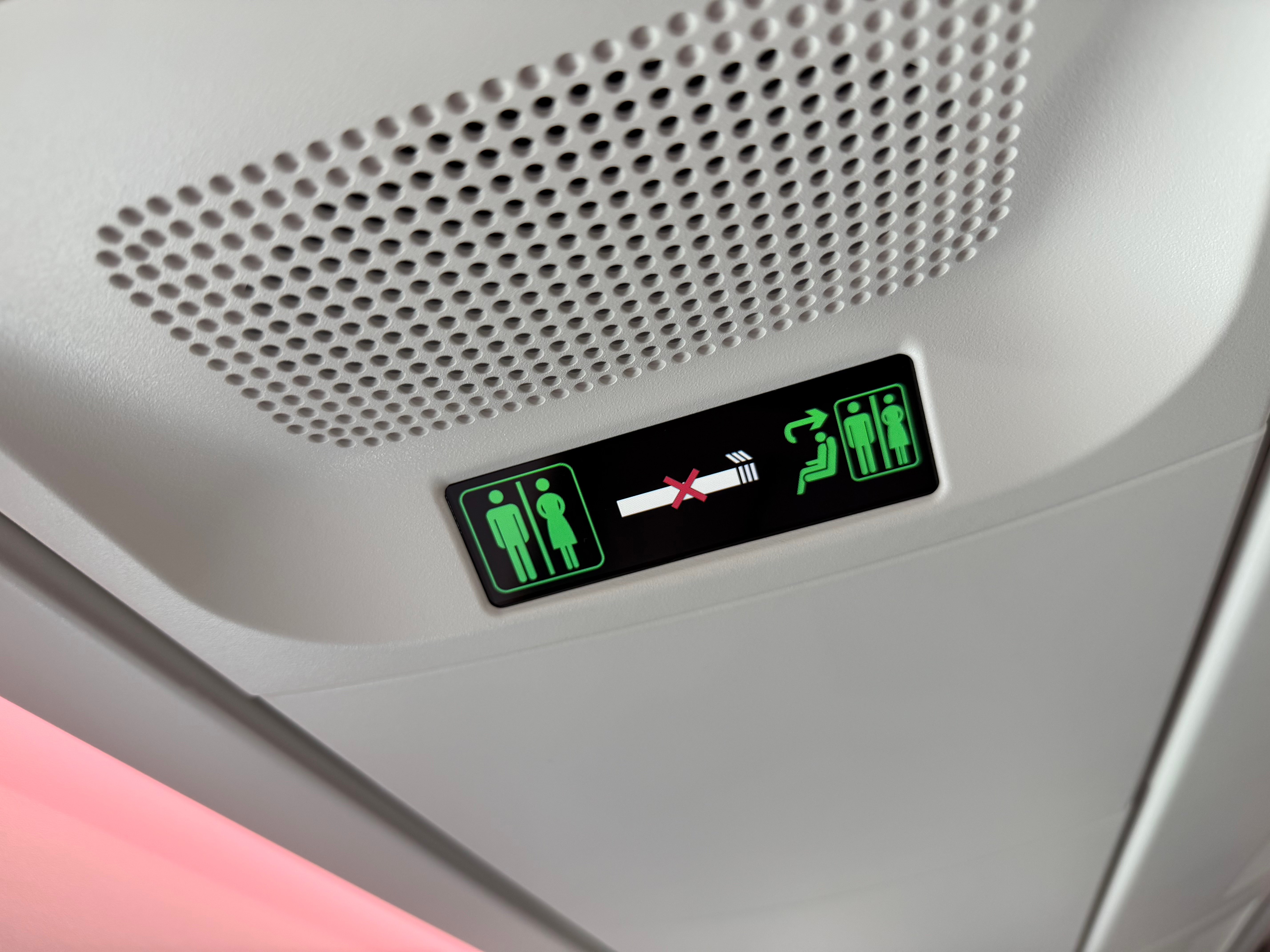 Illuminated lavatory availability signs in the A350 cabin.