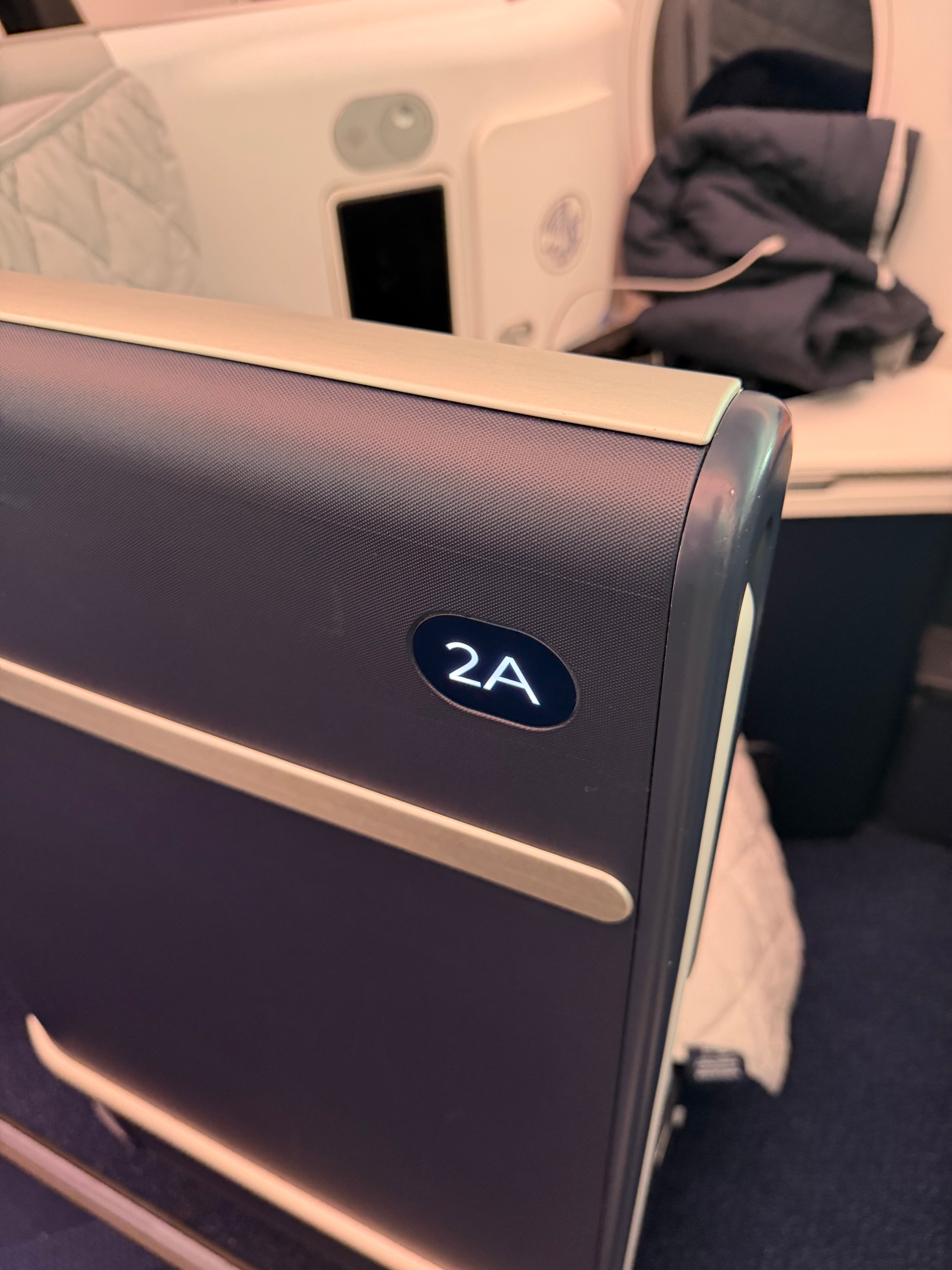 Seat 2A label on the suite wall.
