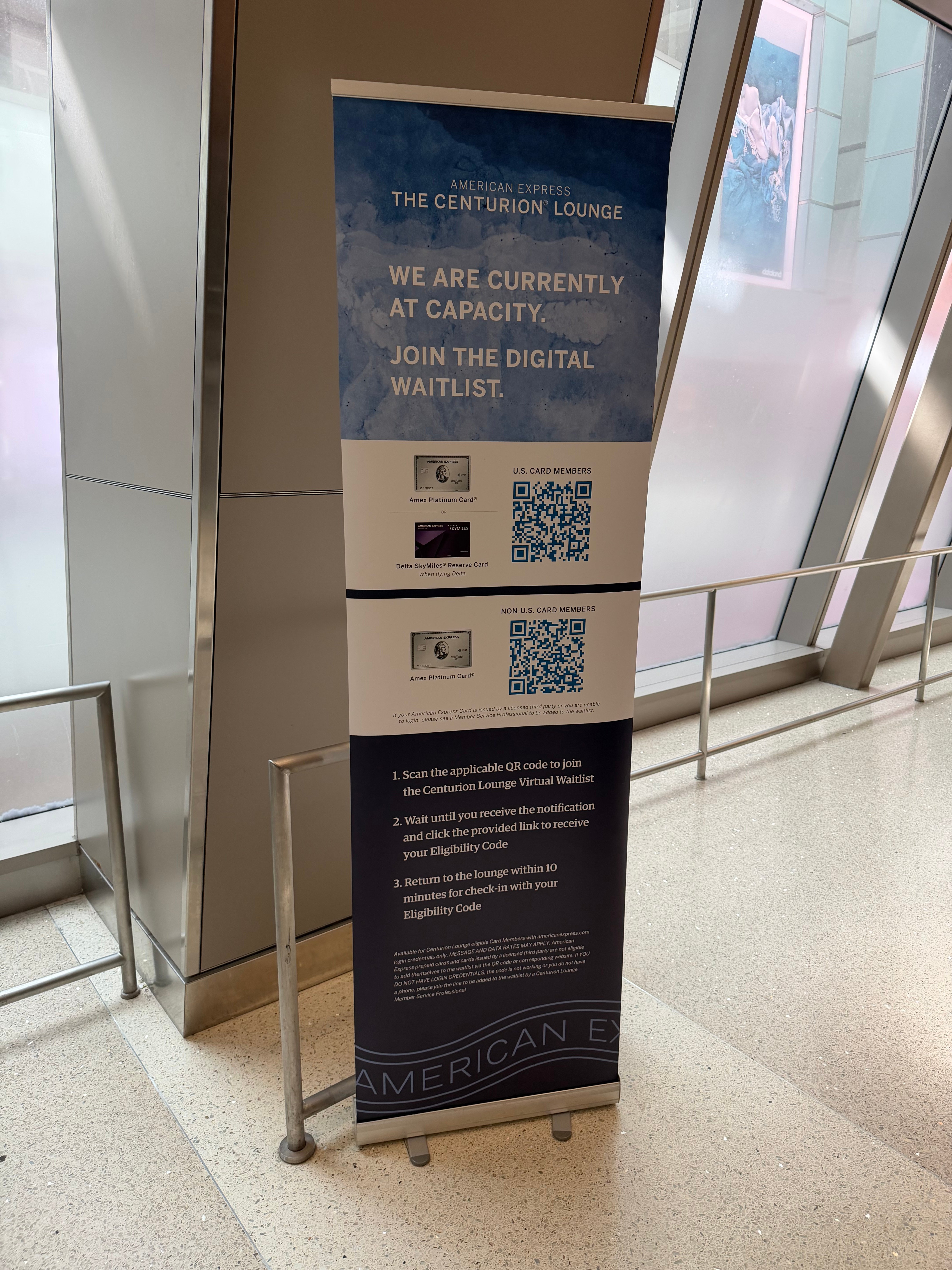 Centurion Lounge sign asking passengers to join the digital waitlist because the lounge was at capacity.