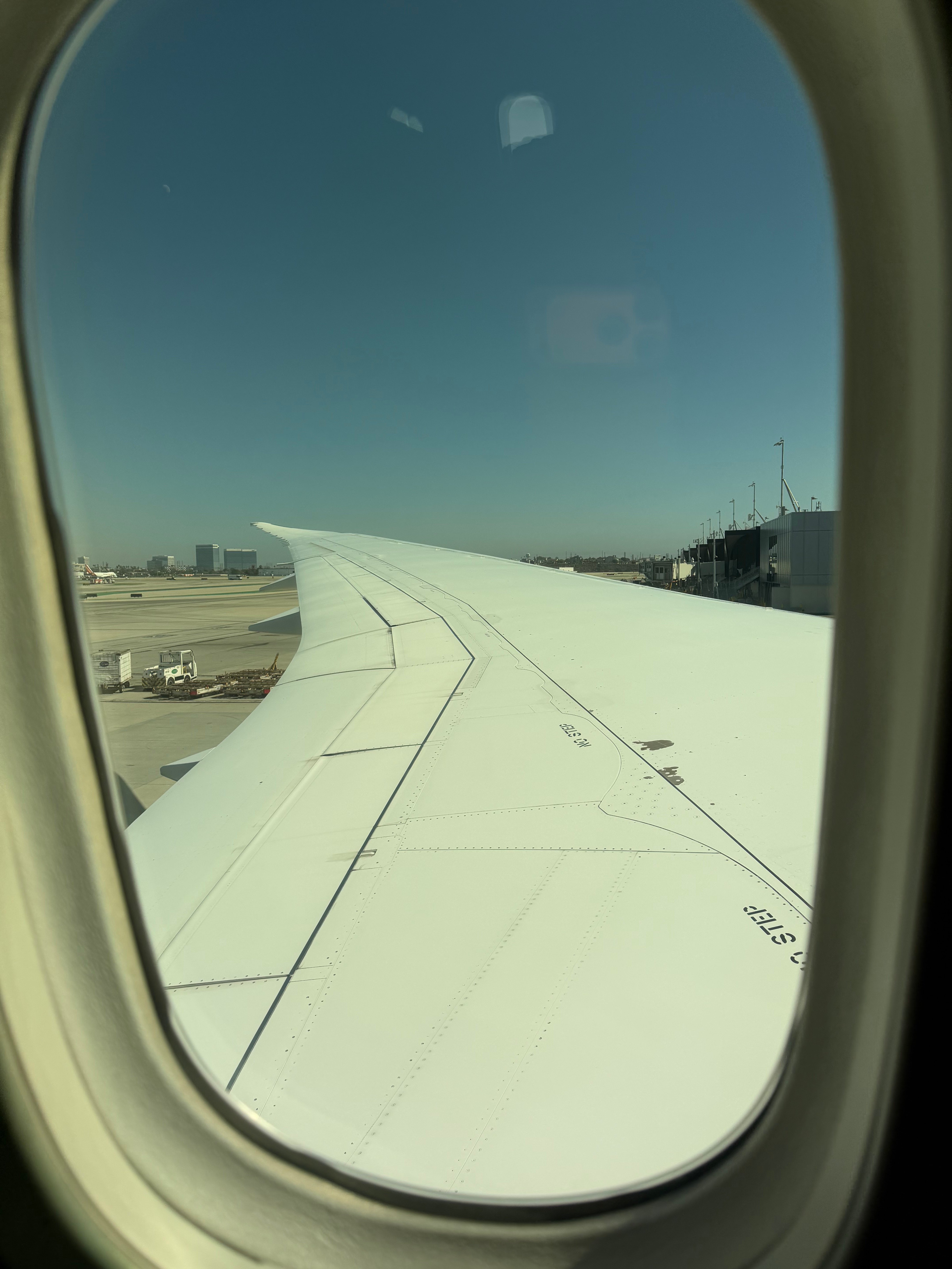 Air Tahiti Nui Boeing 787-9 wing seen from the Economy cabin at LAX.