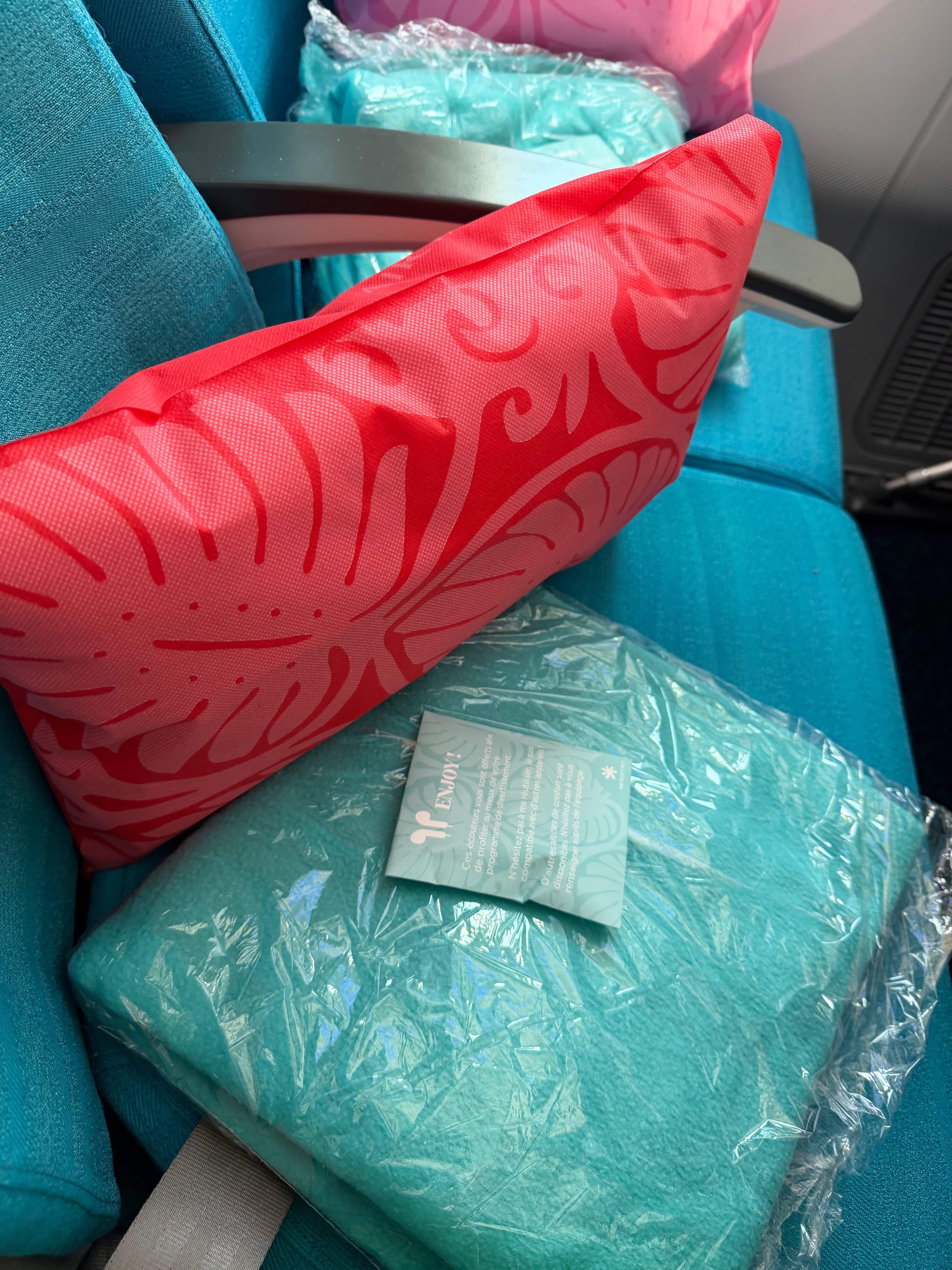 Air Tahiti Nui Moana Economy pillow and blanket closeup.